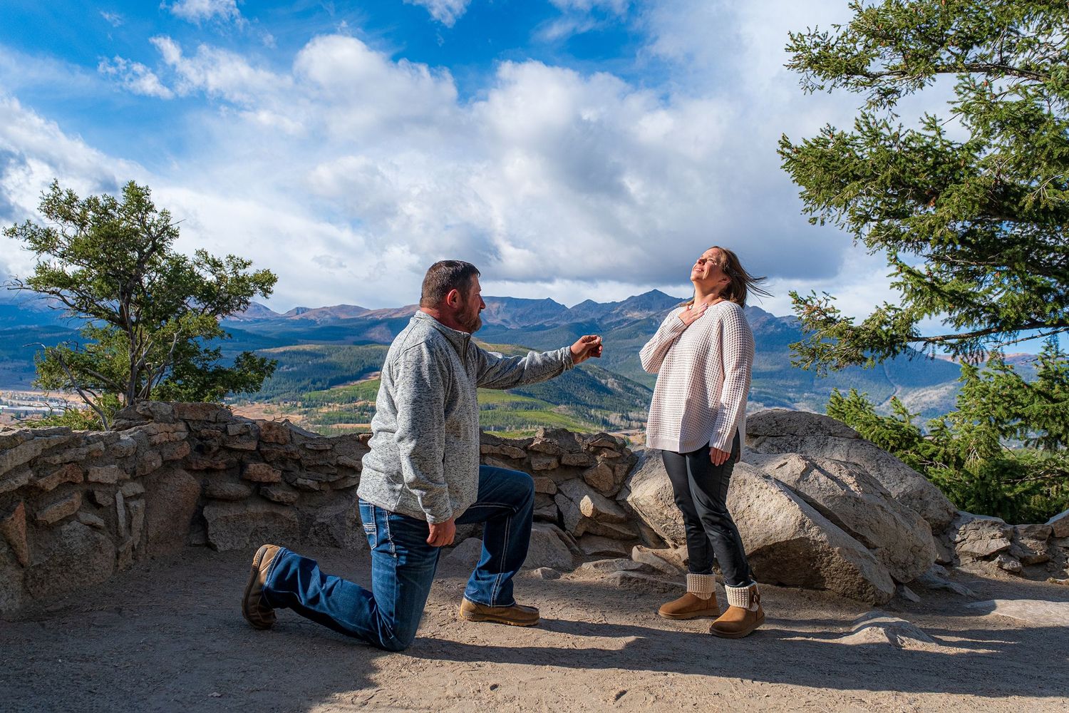 Woman reacting to a surprise proposal at Sapphire Point near Breckenridge in the fall.