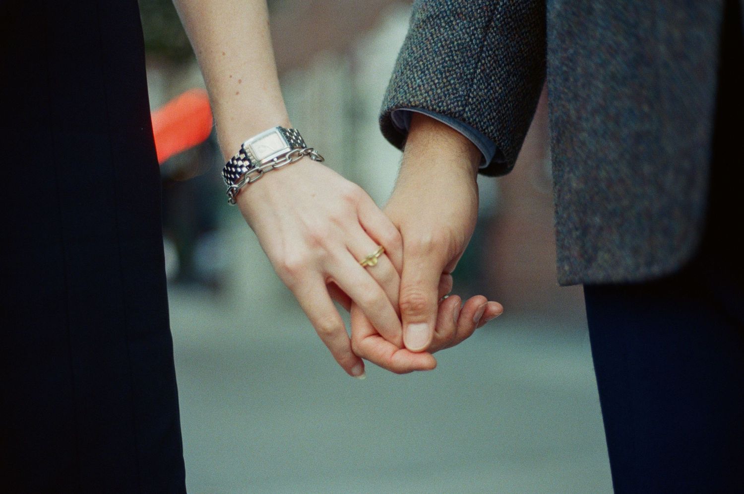 Close-up series of hands holding and clasping together in different intimate poses against dark backgrounds.