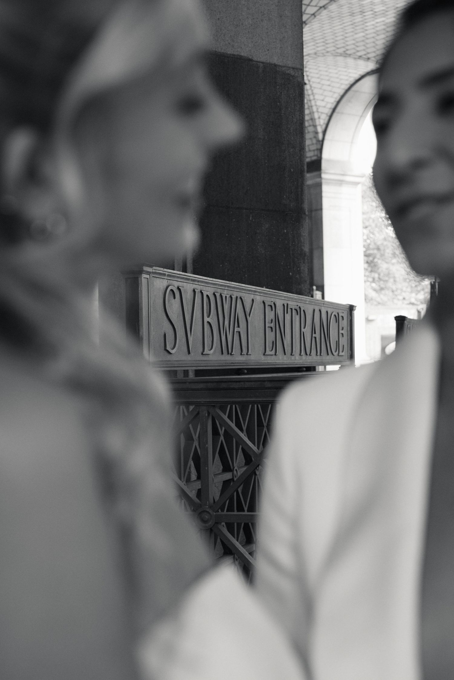 Black and white artistic portrait series showing blurred profile views and subway entrance signage.