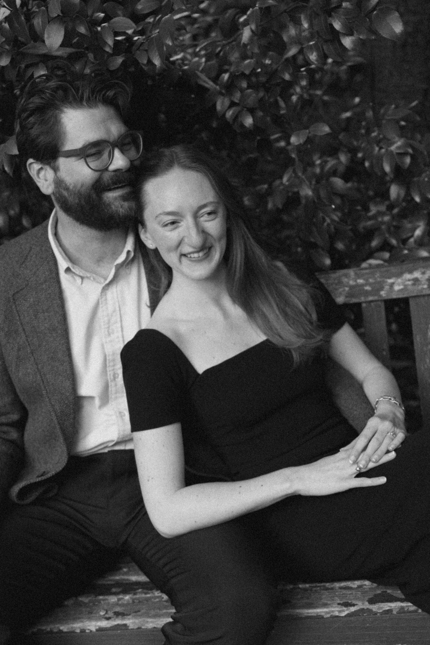 A couple in black and white shares intimate moments in a series of candid photographs.