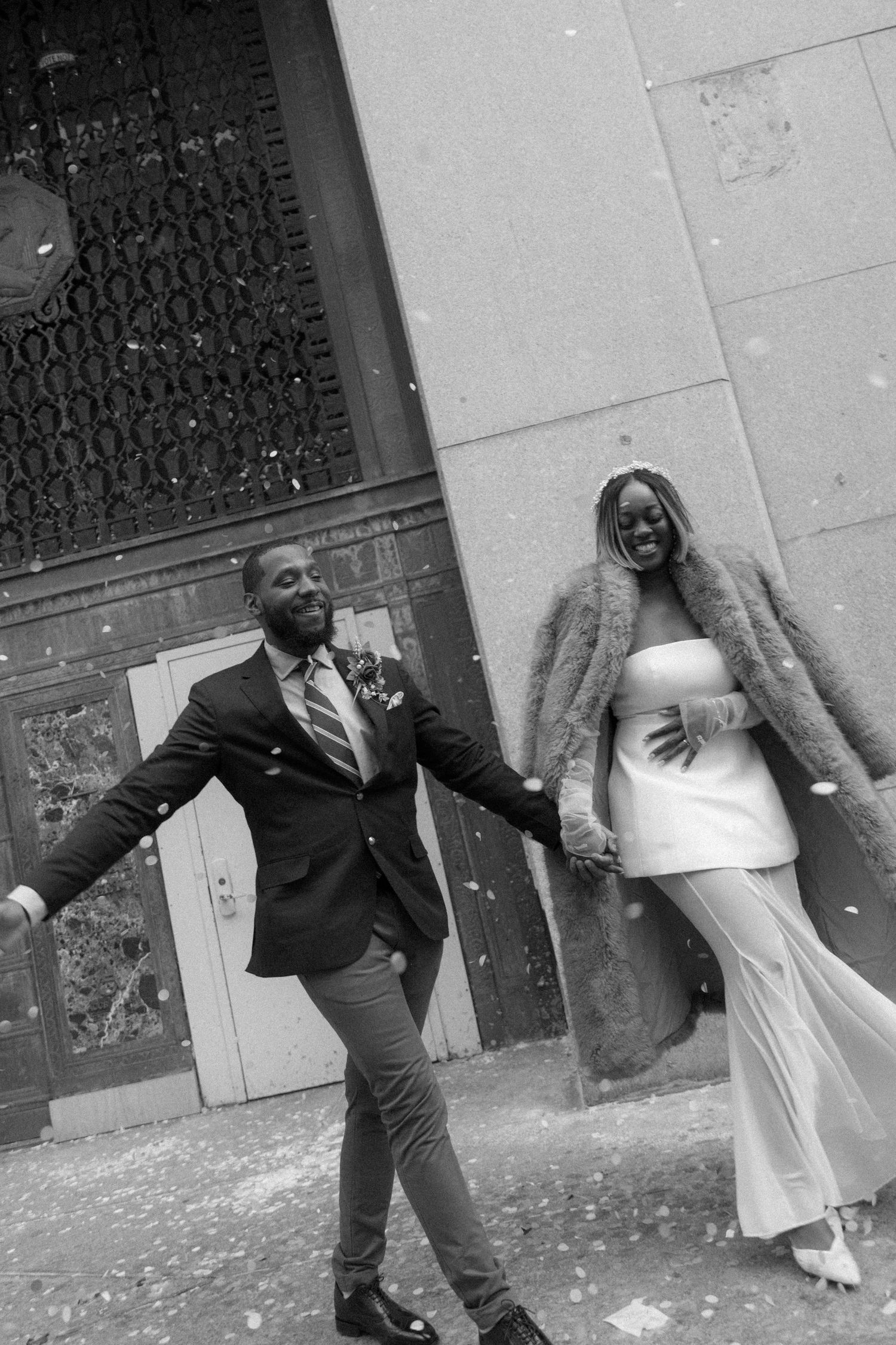 A black and white photo sequence shows a couple playfully dancing and posing together outside a building.