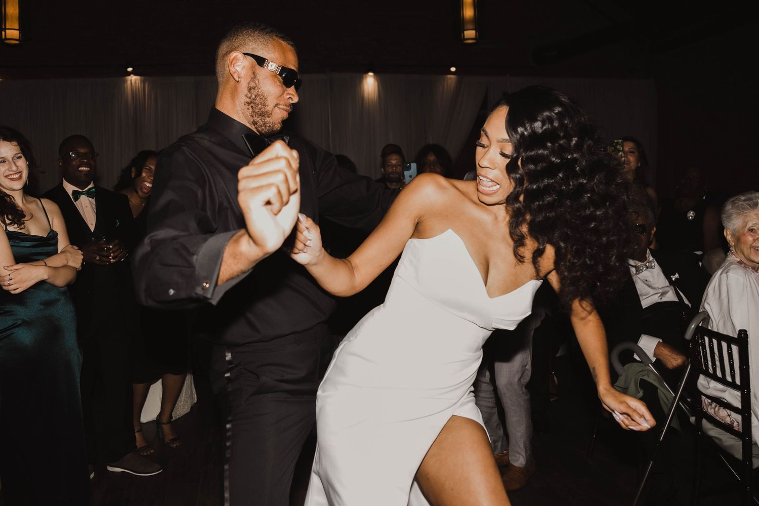 Dancing couple in formal attire enjoying their wedding reception.
