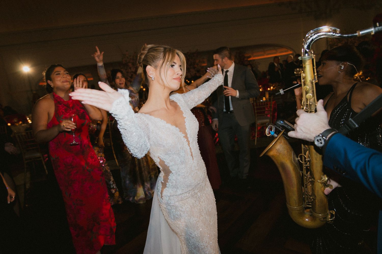 Wedding reception dance floor filled with joyful celebration and dancing.