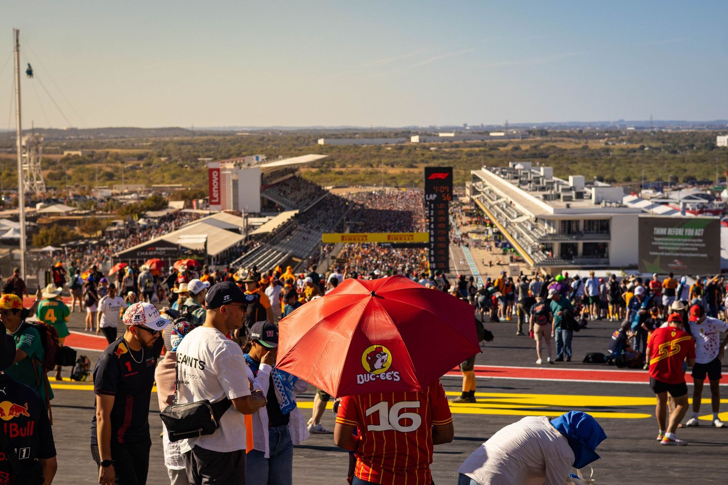 Large crowd of motorsport fans on pit straight overlooking Circuit of the Americas.