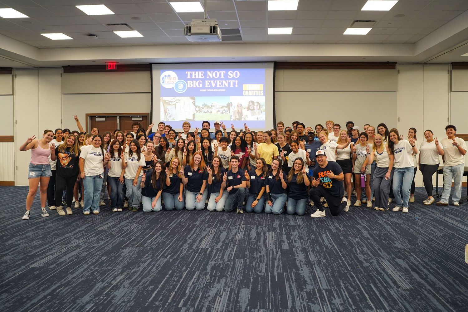 Large group of smiling students pose together at The Not So Big Event campus orientation gathering.