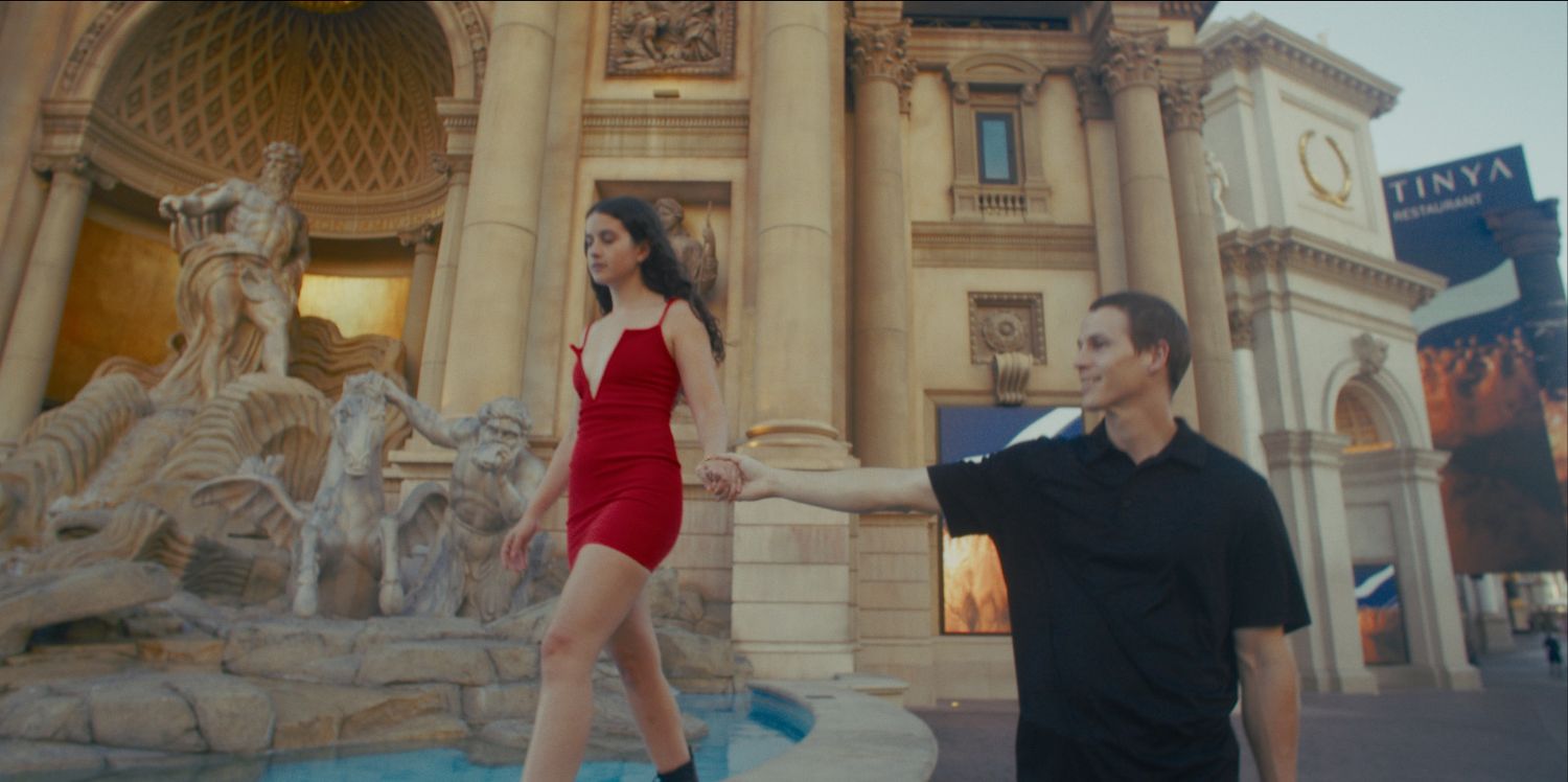 Couple walking near a replica Trevi Fountain at The Venetian resort in Las Vegas.