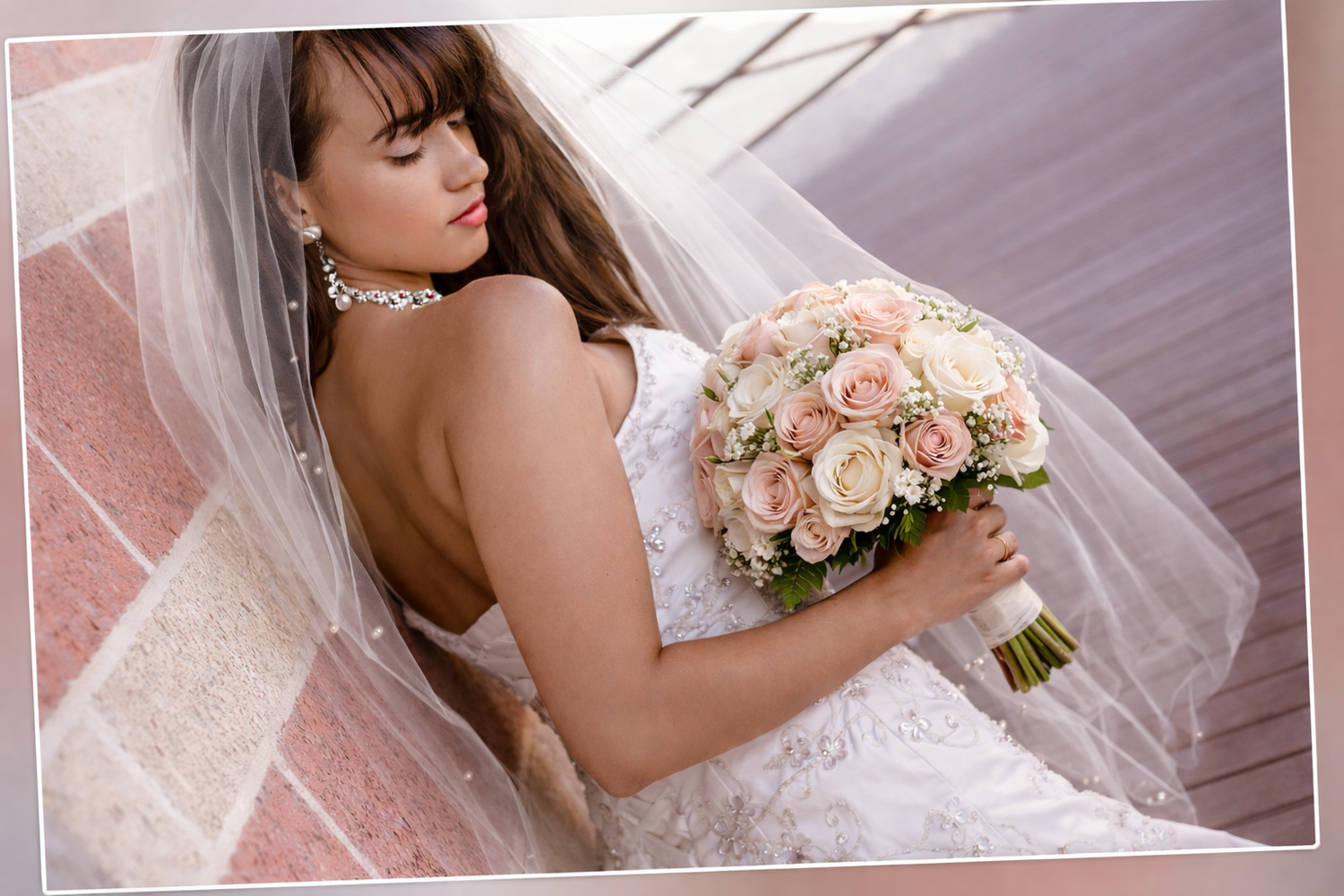 Elegant bride portrait holding bouquet with soft natural light and veil