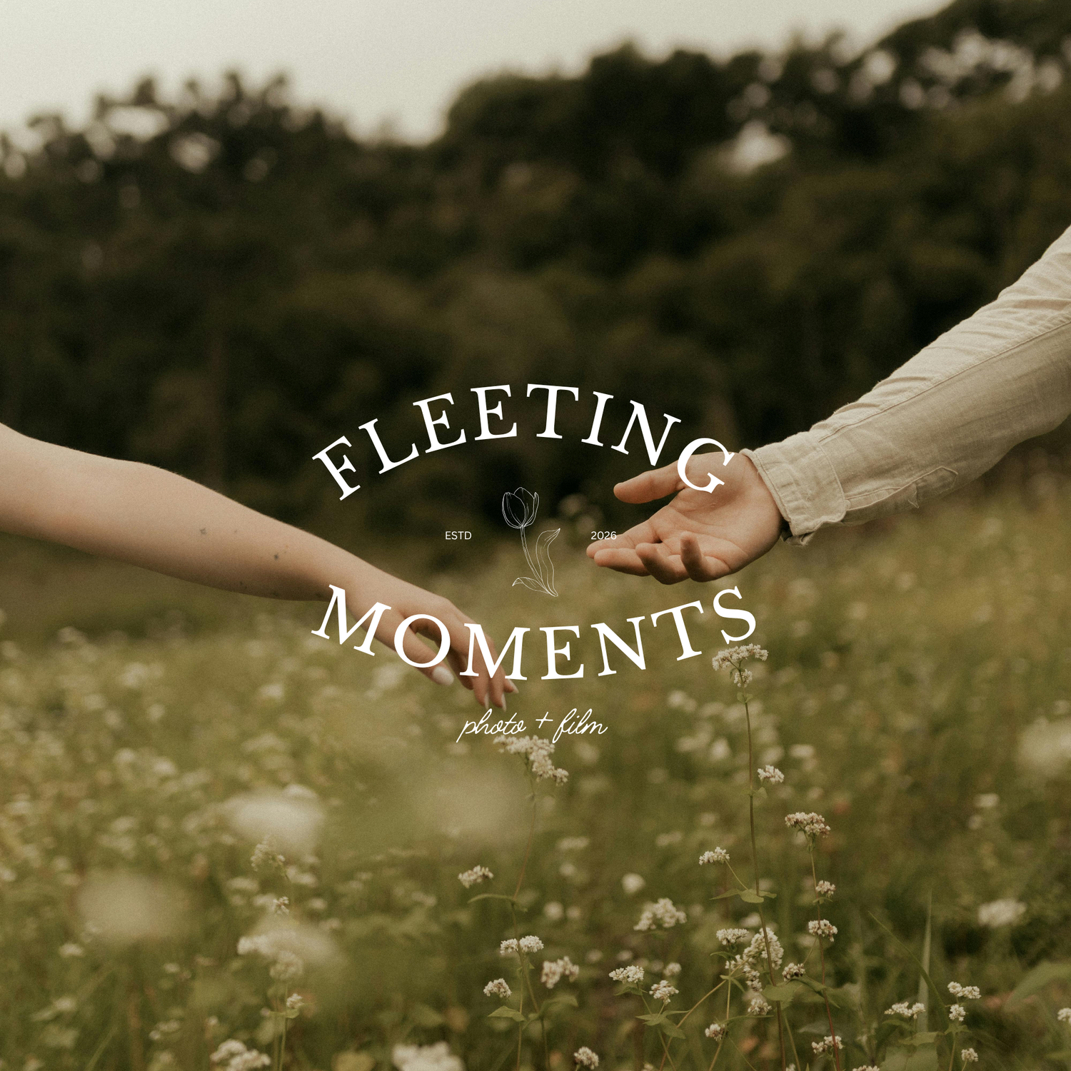 Two people reach toward each other in a wildflower field, with Fleeting Moments photo and film logo overlay.
