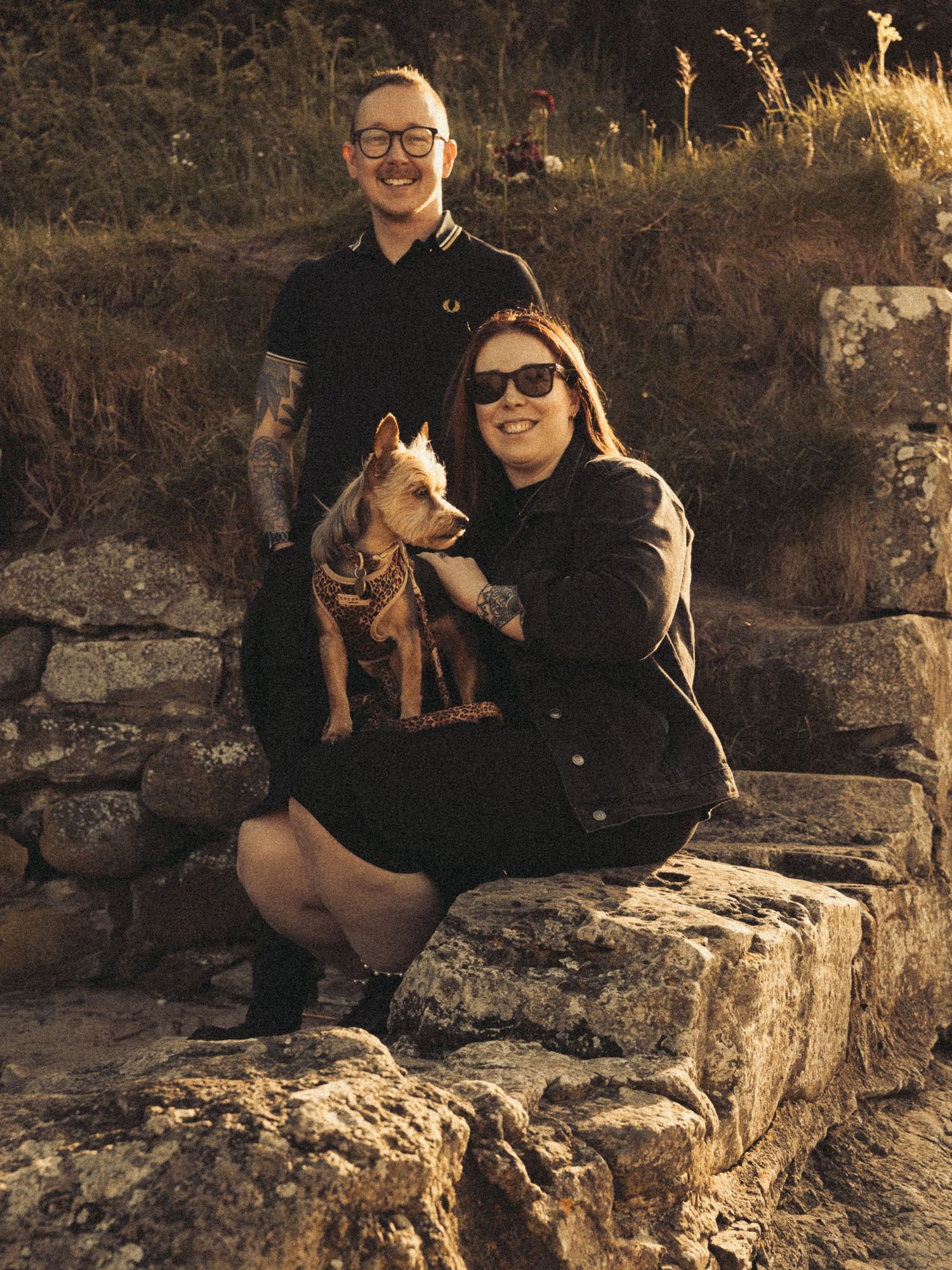 Beach engagement shoot, alternative couple. Doc martens and tattoos.