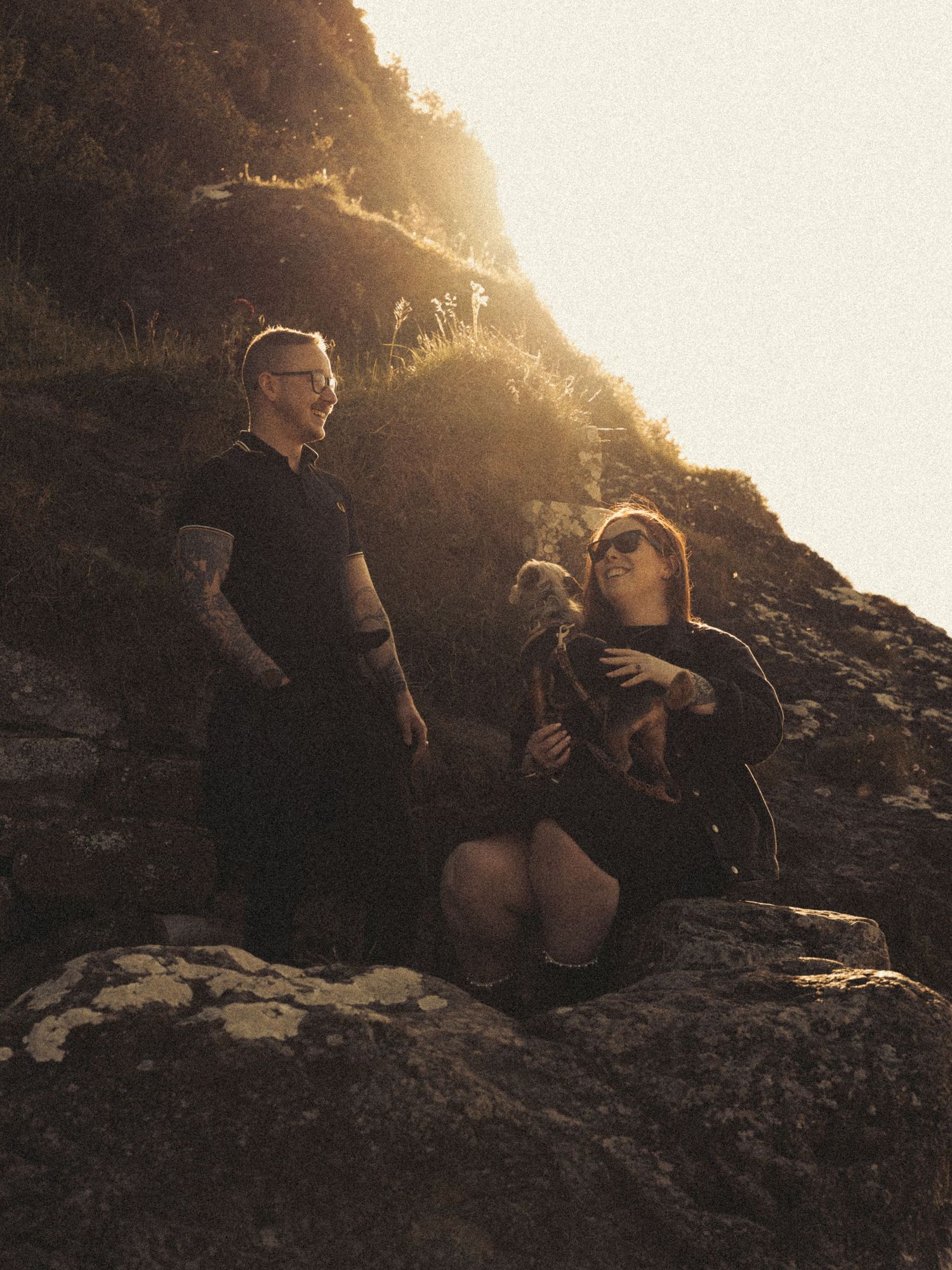 Beach engagement shoot, alternative couple. Doc martens and tattoos.