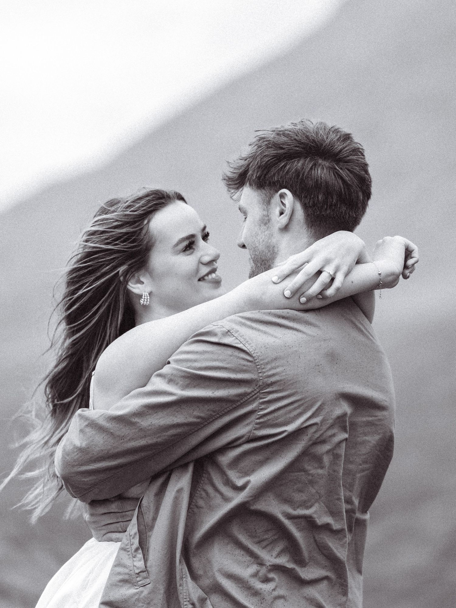 Black and white, editorial, cinematic engagement shoot. Couple embracing. Engagement shoot, couples photographer. Highland elopement.