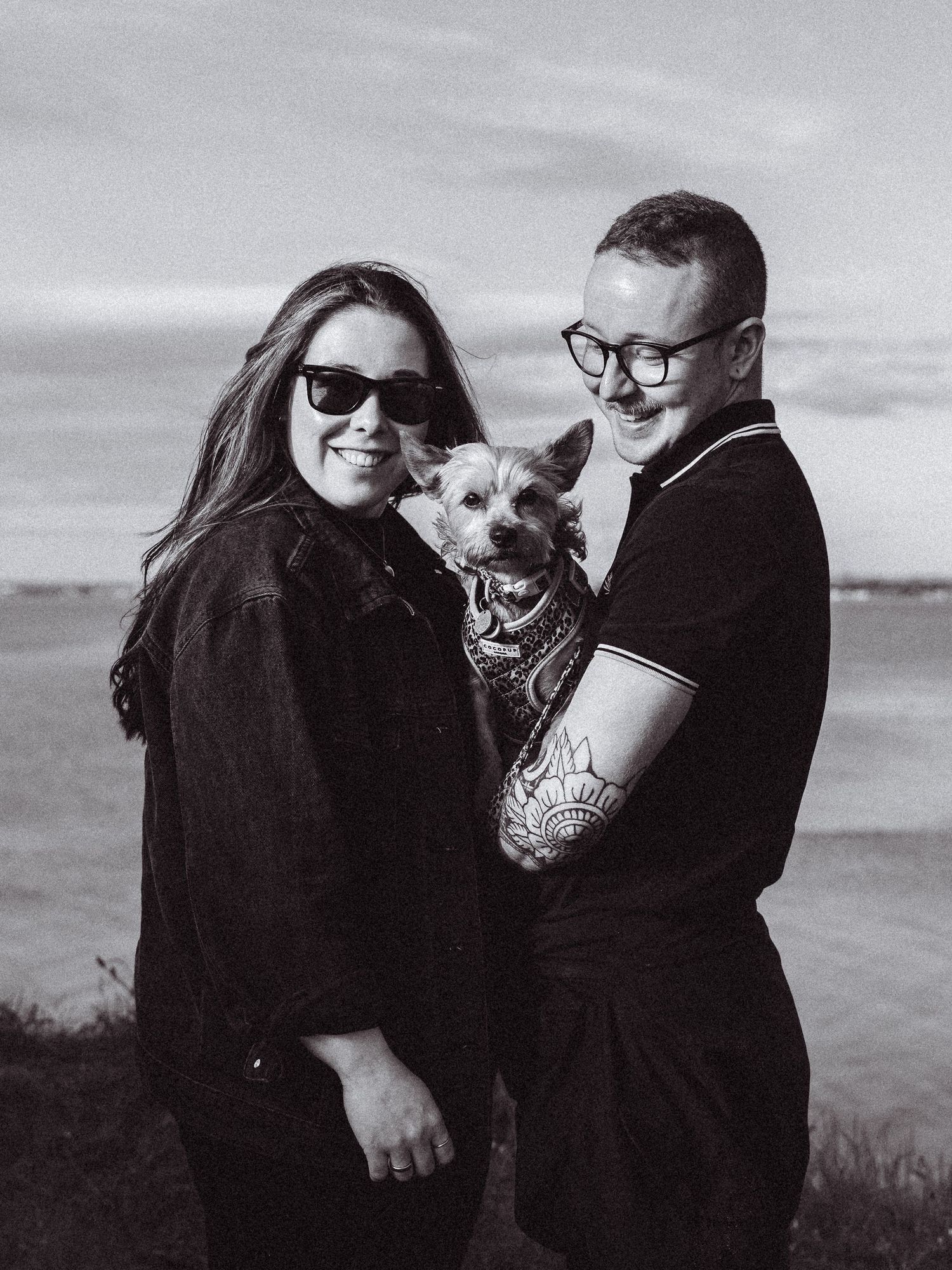 Beach engagement shoot, alternative couple. Doc martens and tattoos.
