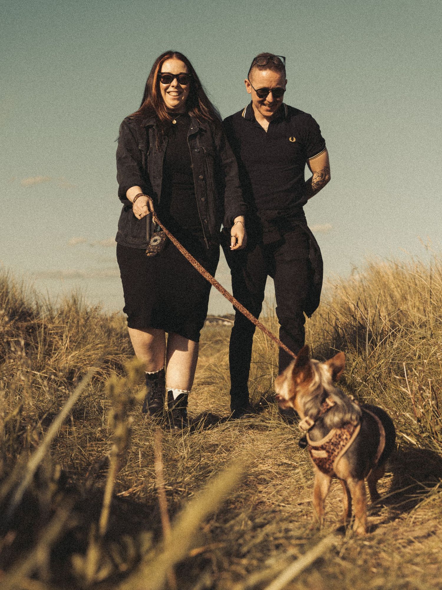 Beach engagement shoot, alternative couple. Doc martens and tattoos.