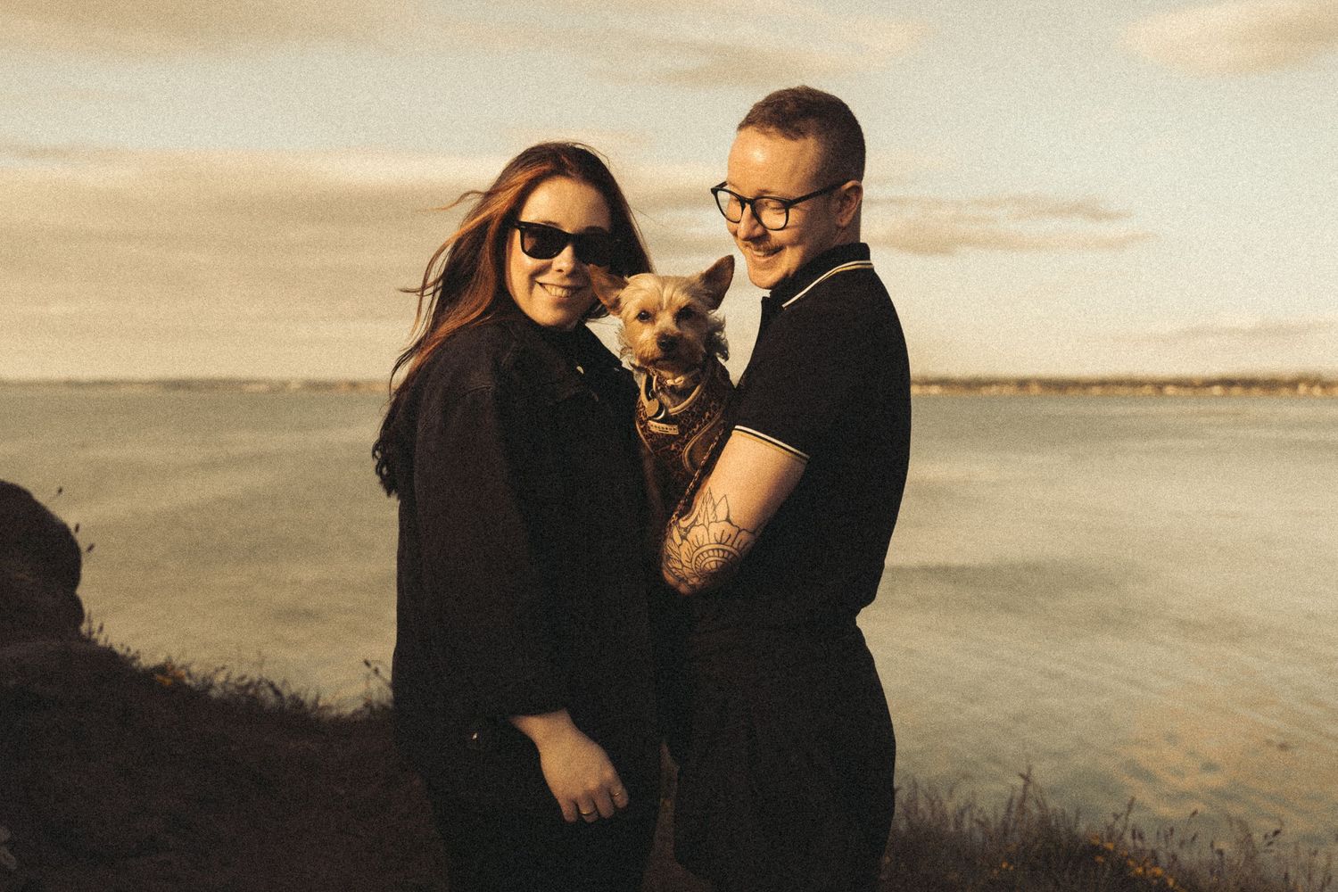 Beach engagement shoot, alternative couple. Doc martens and tattoos.