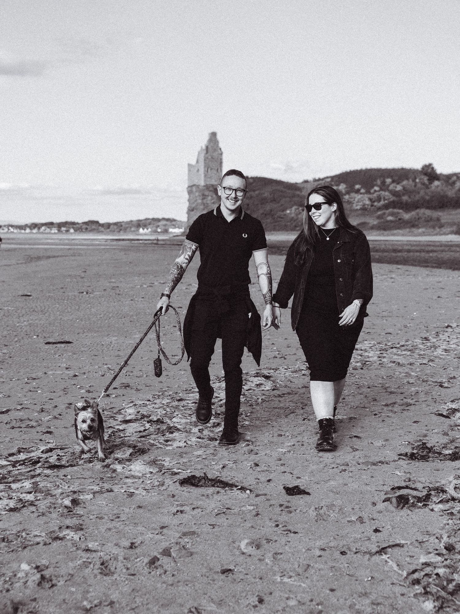 Beach engagement shoot, alternative couple. Doc martens and tattoos.