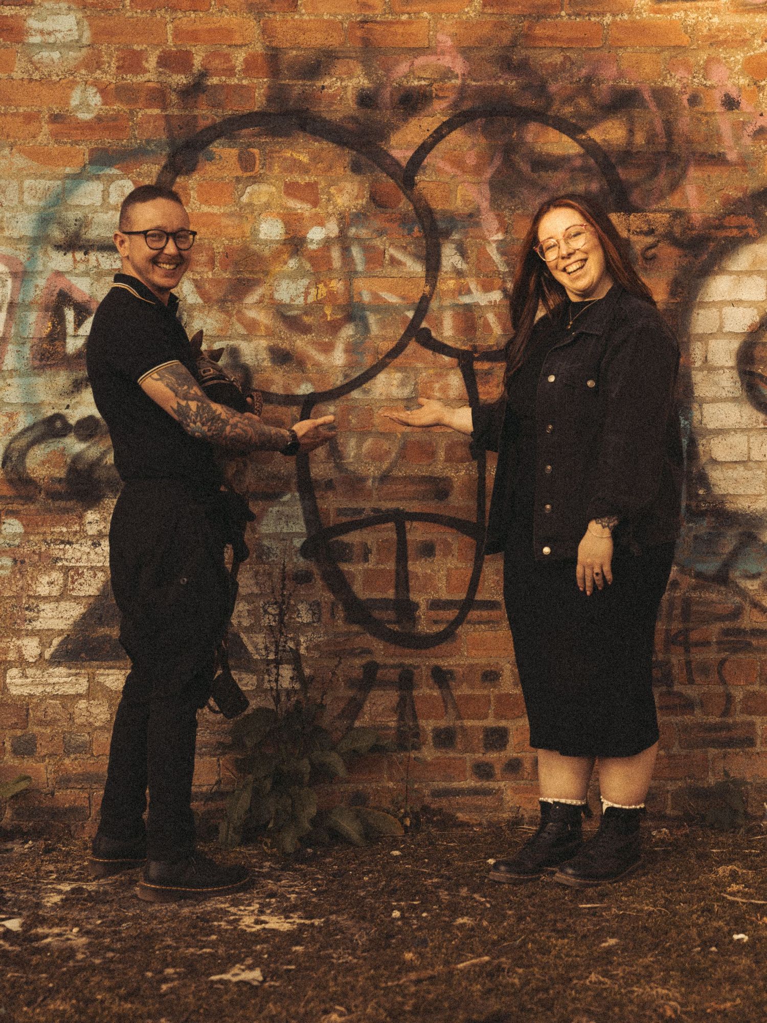 Beach engagement shoot, alternative couple. Doc martens and tattoos.