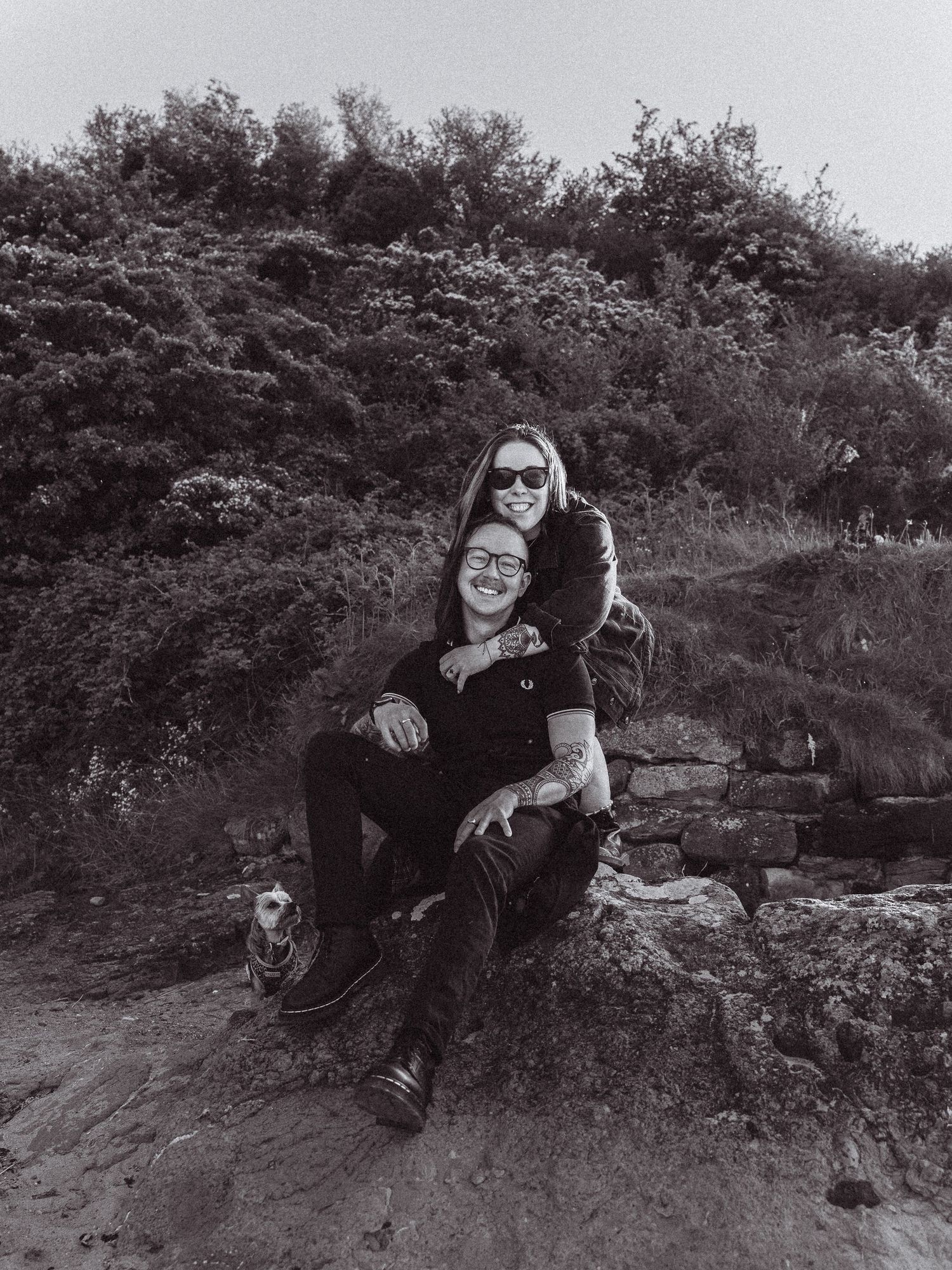 Beach engagement shoot, alternative couple. Doc martens and tattoos.
