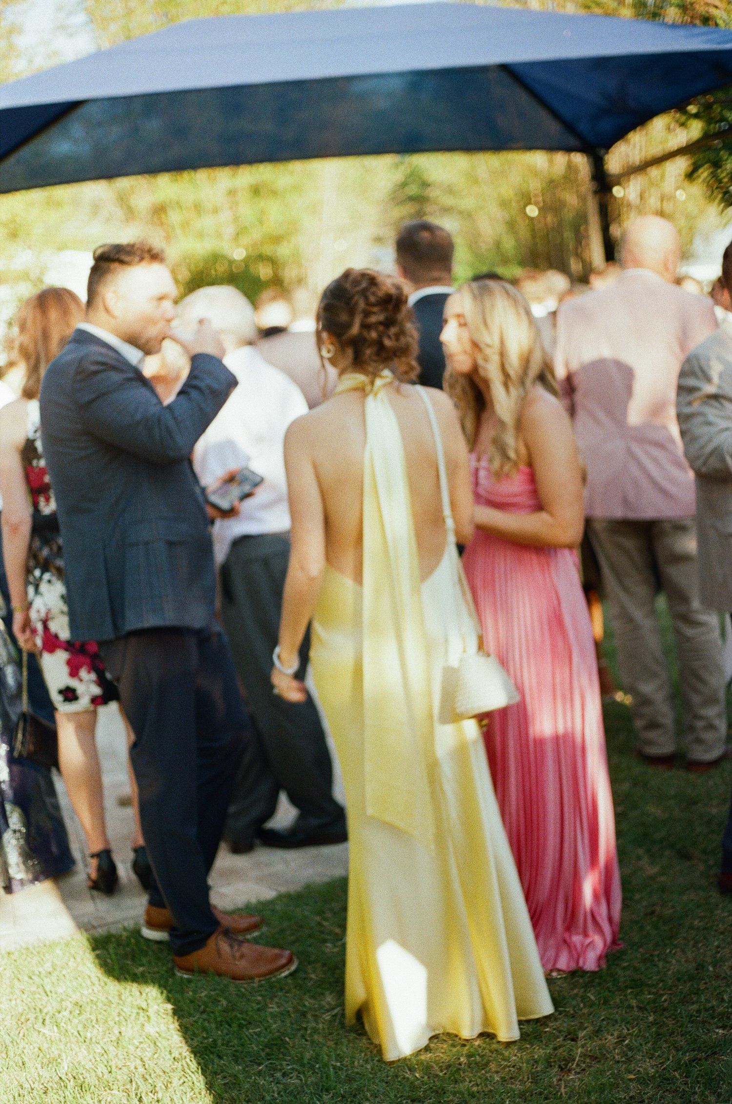 Elegant outdoor wedding guests outfits documented on Film Photography.