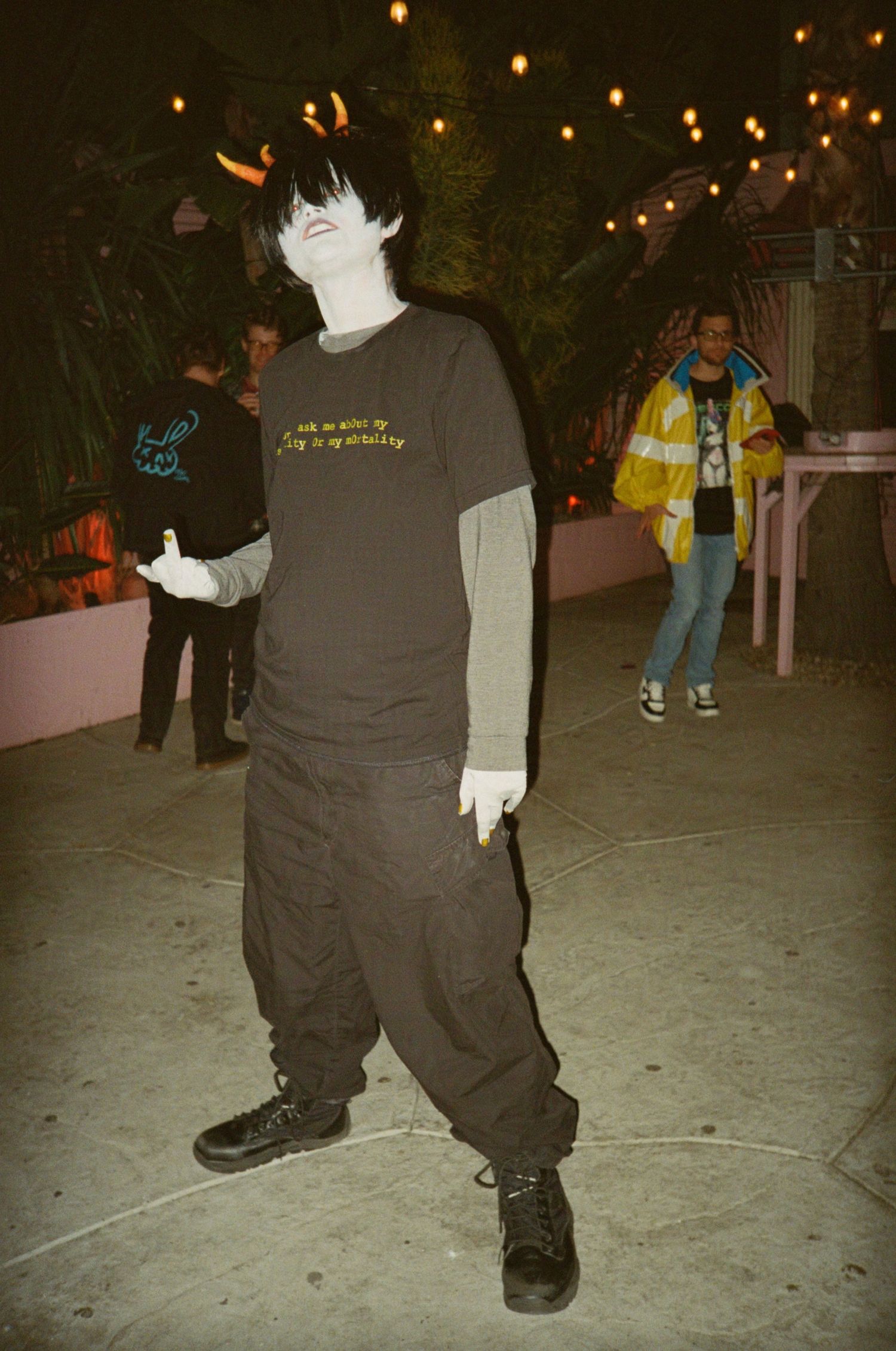 Someone dressed as a Homestuck troll poses for a photo. (Afterpunk 2077 Lizzie's Bar at High Tide DTLA)

35mm film photo
© snapnon 2026