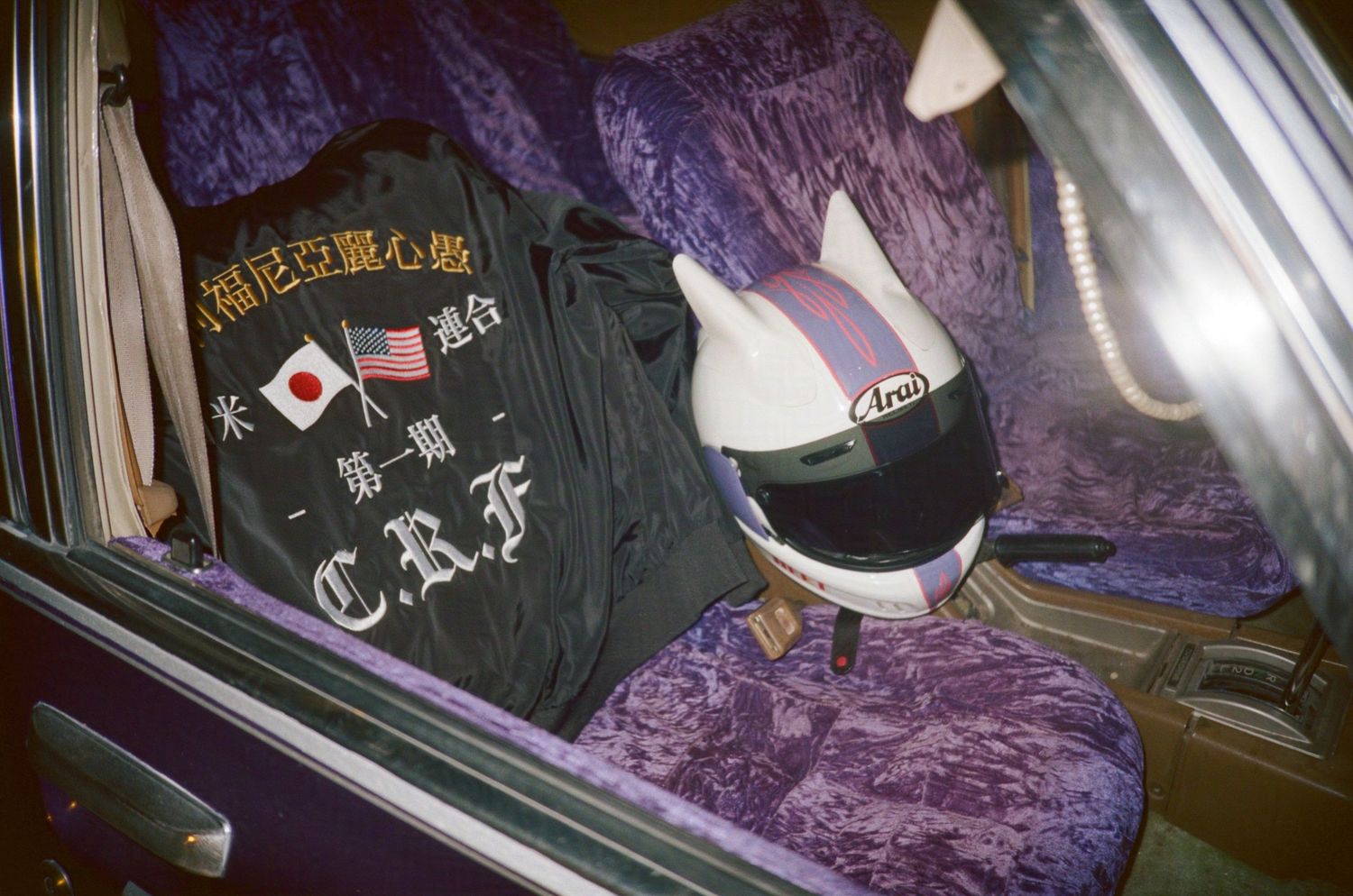 Custom purple car interior with ear helmet and jacket. (Machine Aesthetic at 8th and Santa Fe)

35mm film photo
© snapnon 2026