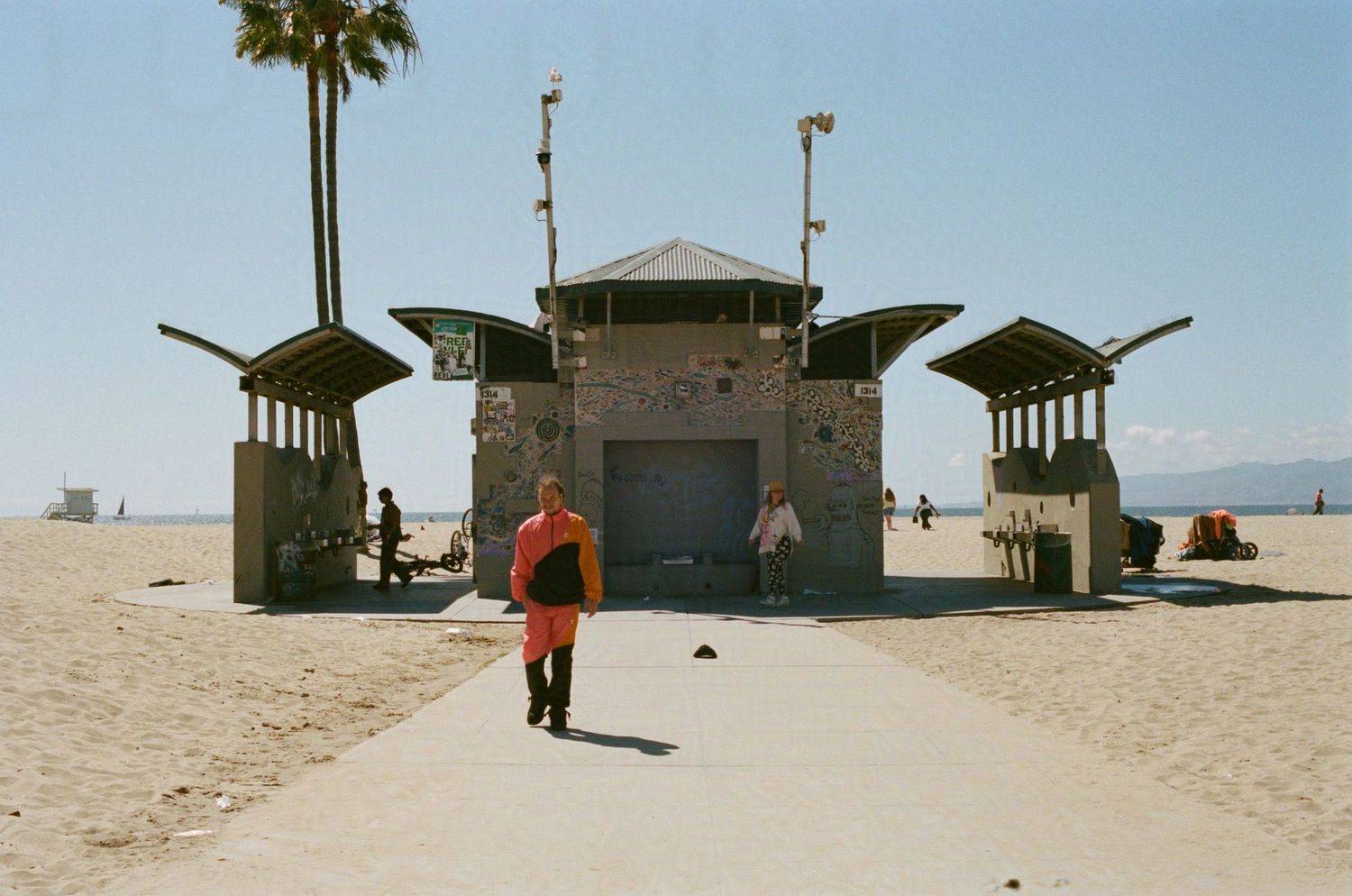 A concrete bathroom bunker on Venice Beach.

35mm film photo
© snapnon 2026