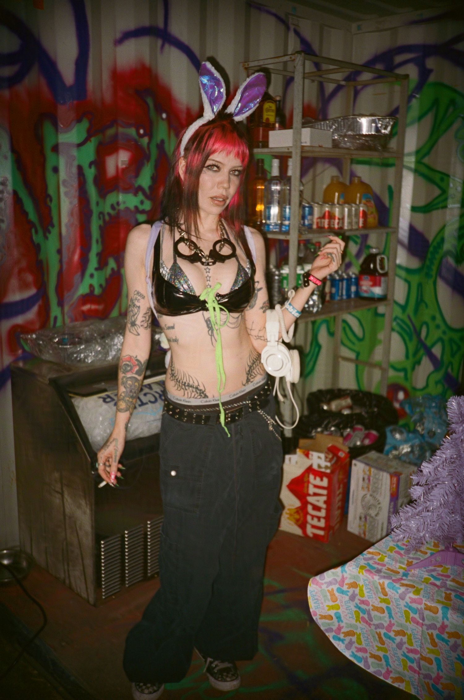 The DJ Angels Milk poses for a photo with their bunny ears on. (99warehouse)

35mm film photo
© snapnon 2026
