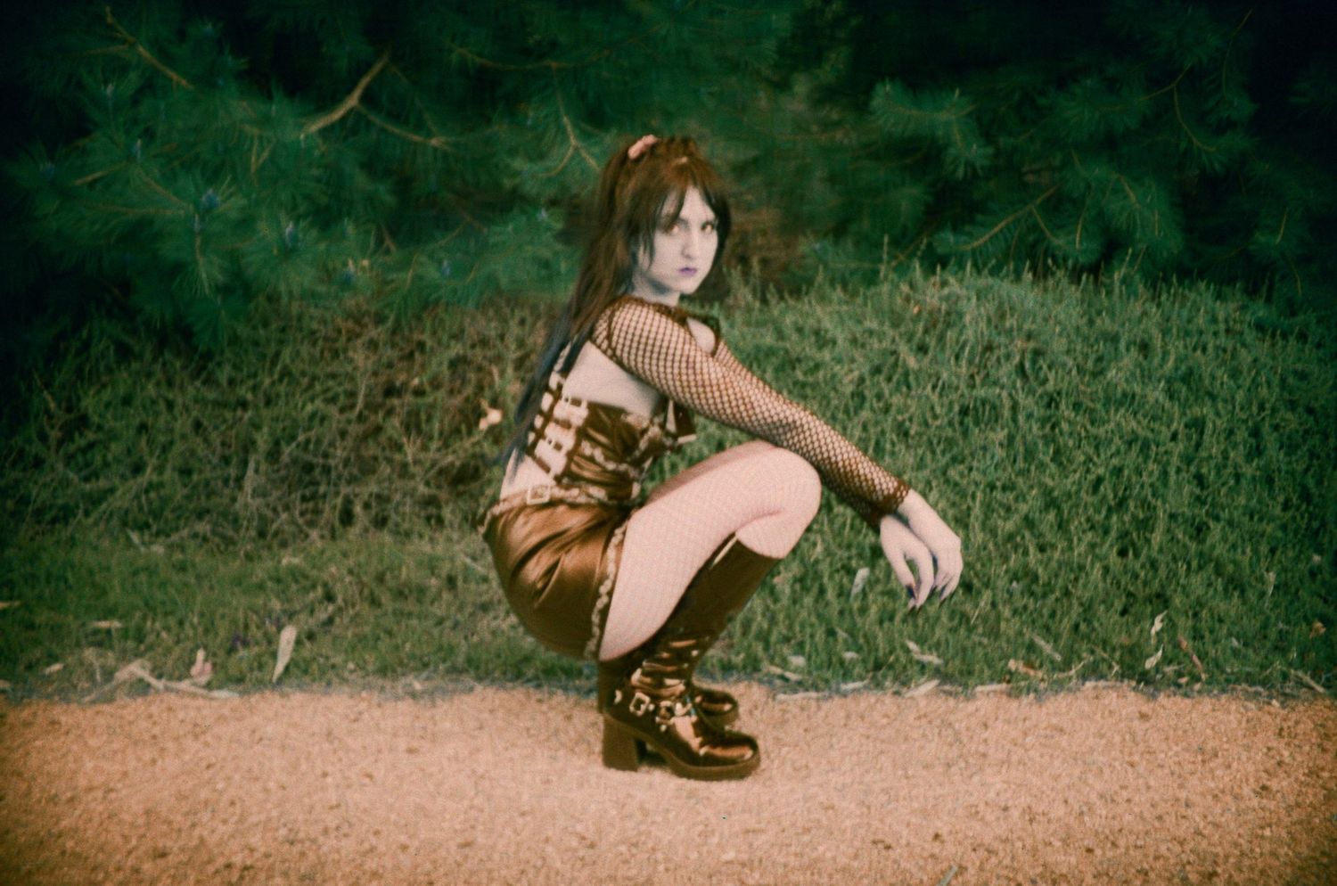 Violet poses in her goth outfit outside, shot on LomoChrome Turquoise film.

35mm film photo
© snapnon 2026