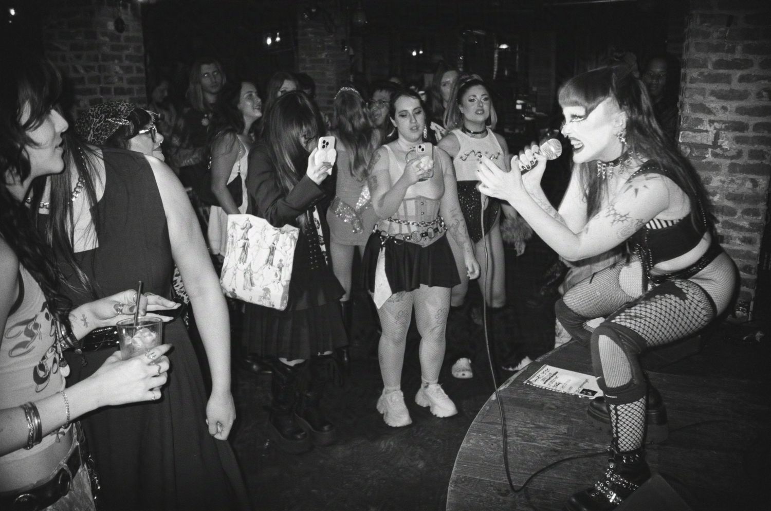 Maya Karli performs to the audience. (Queerchella at Madame Siam)

35mm film photo
© snapnon 2026