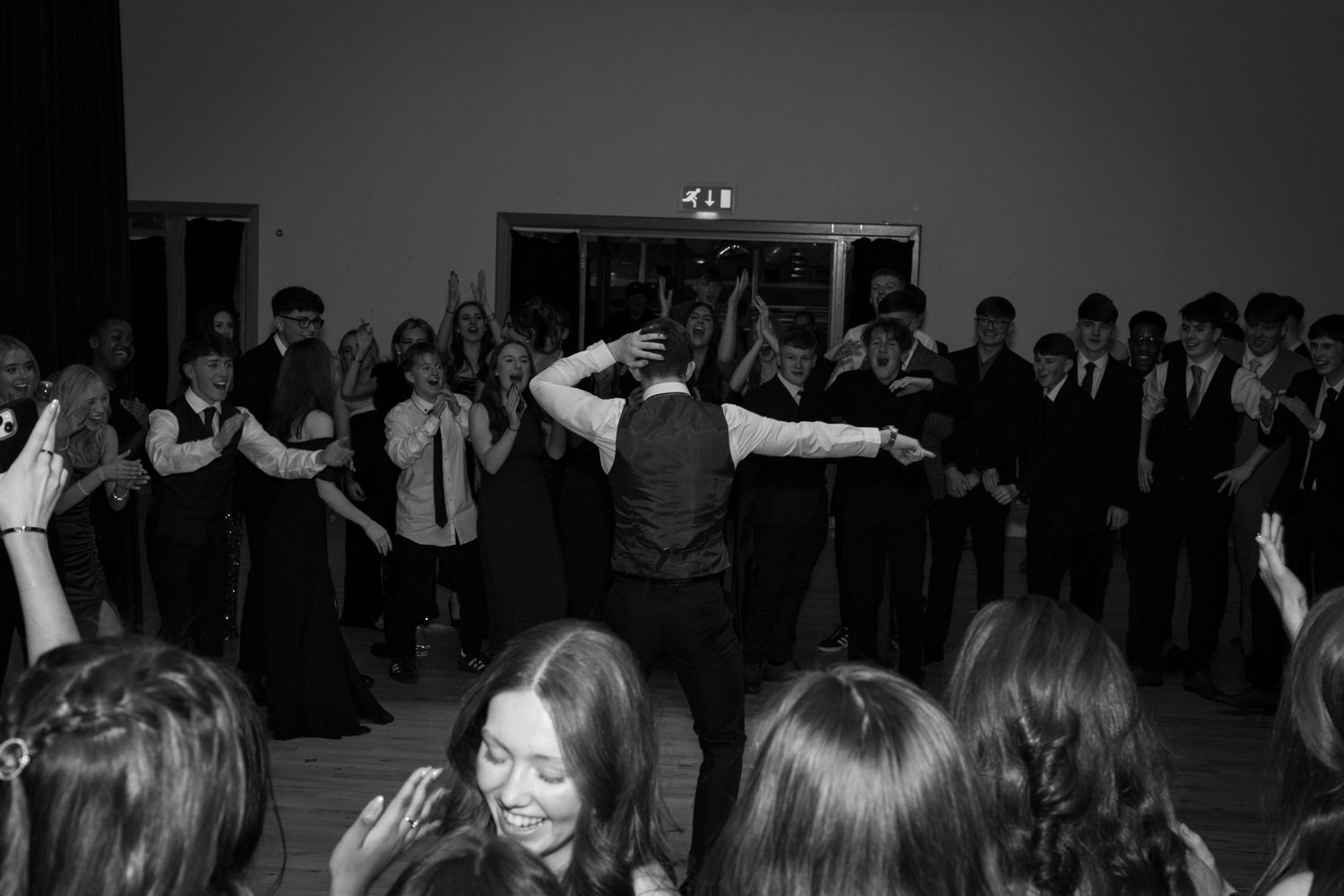 dance circle with person in the middle at a winter school party in Edinburgh in black and white.

Edinburgh Event Photographer.