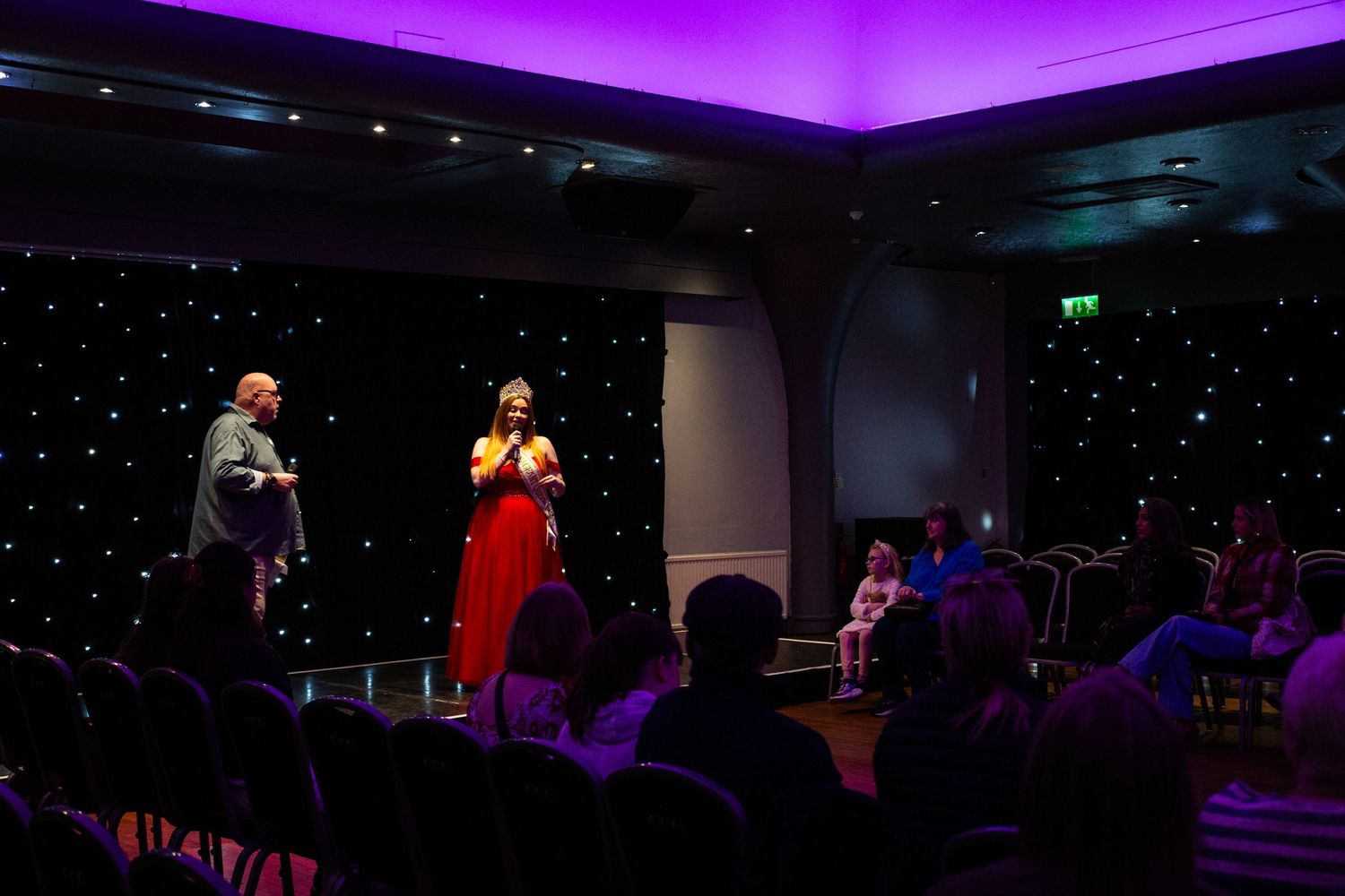 Hosts at a fashion show talking to the crowd.

Edinburgh Event Photographer.