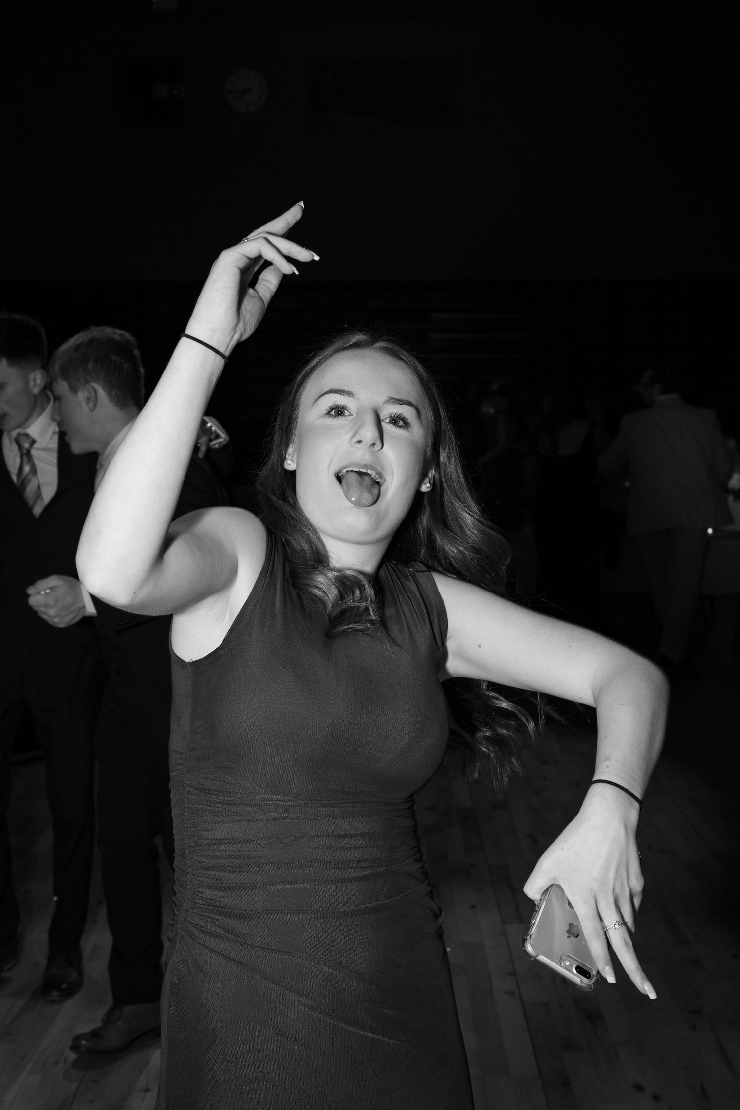 A girl dancing at a winter ball party event in the hall of a school in Edinburgh in black and white.

Edinburgh Event Photographer.