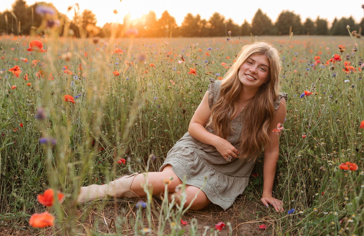 Senior girl in wildflower field.
