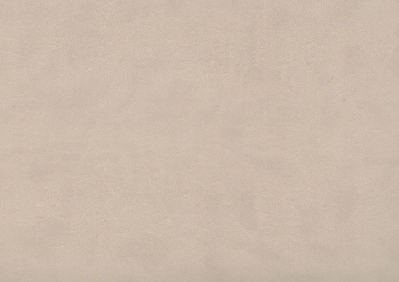 A close-up view of a textured beige wall surface showing subtle variations in color and grain pattern.