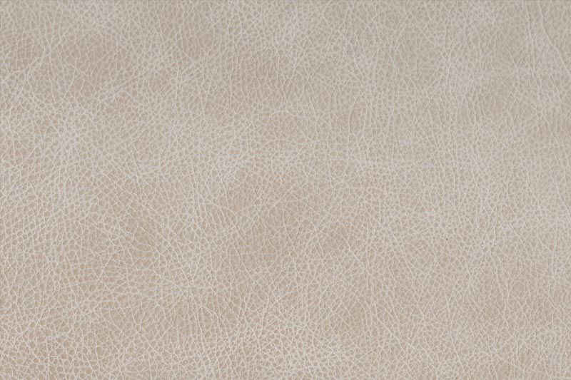 A close-up view of a textured gray surface showing subtle variations in tone and pattern.
