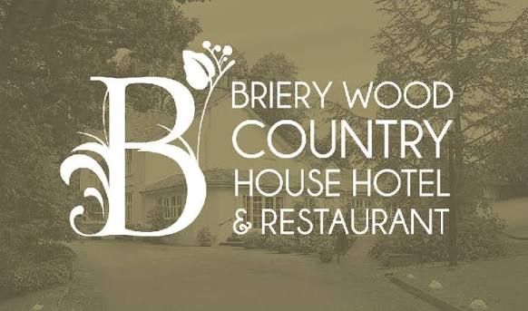 Logo of Briery Wood Country House Hotel and Restaurant, featuring an ornate letter B with floral design.