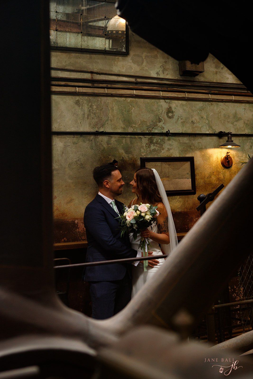 • Relaxed and unposed couple portraits against the exposed brickwork at Holmes Mill wedding venue