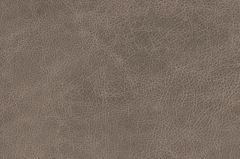 A close-up texture of gray leather material showing a detailed grain pattern and surface texture.