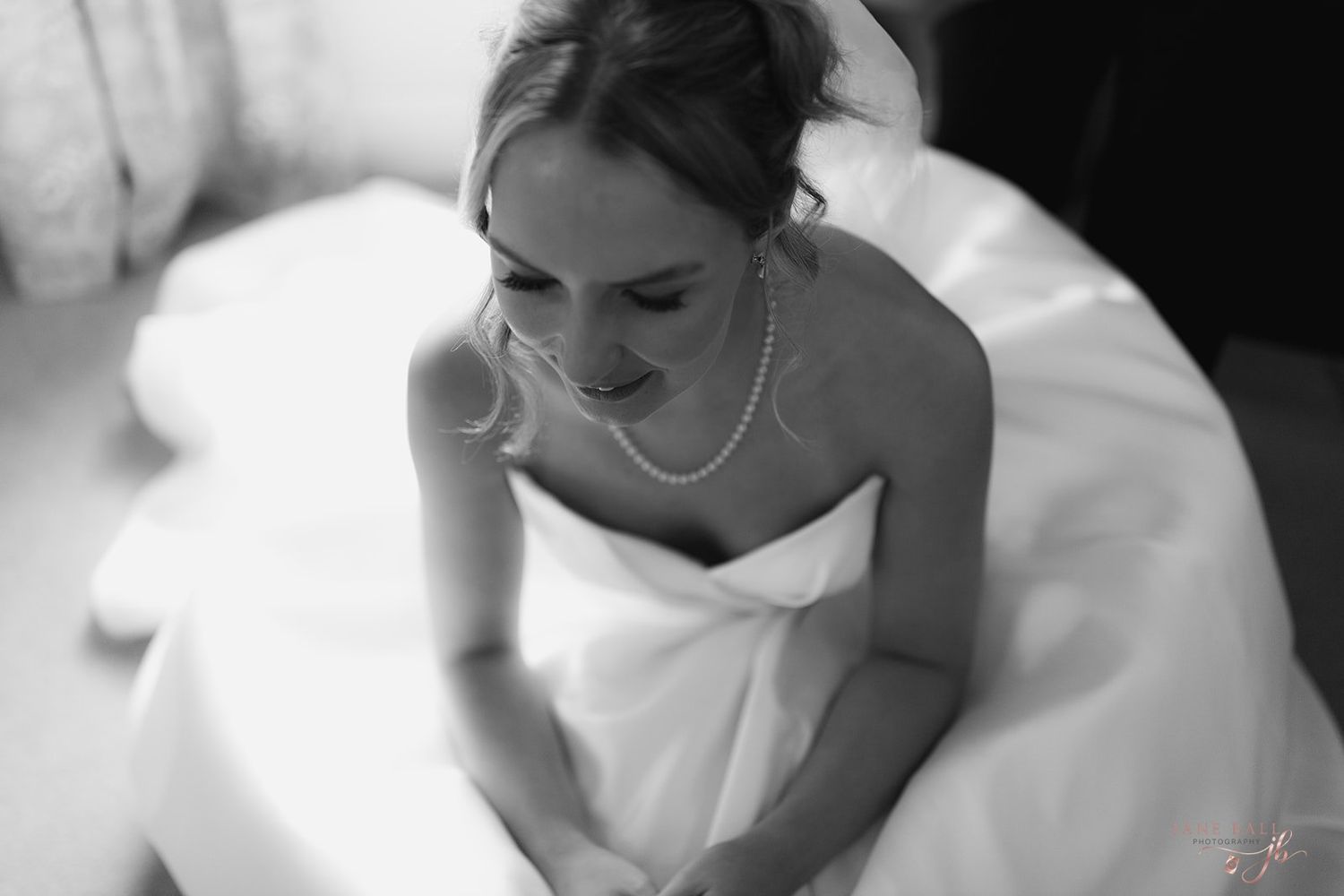 Black and white wedding photography collage showing intimate moments of a bride in her white gown.
