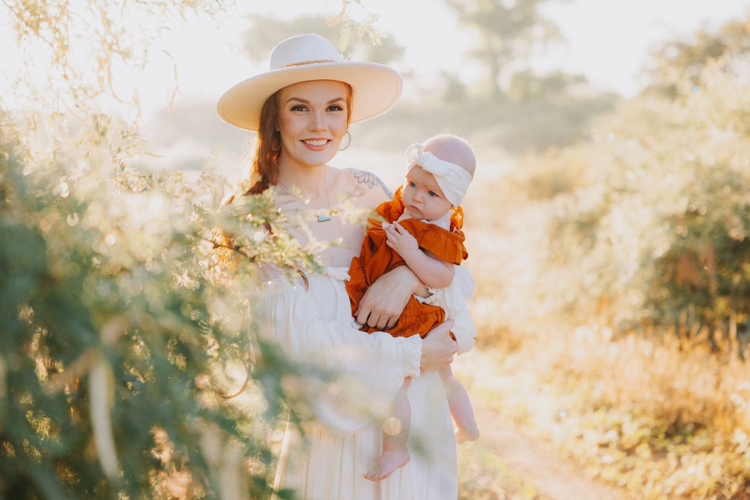 Family photos in desert setting with warm sunset lighting and rustic natural backdrop.