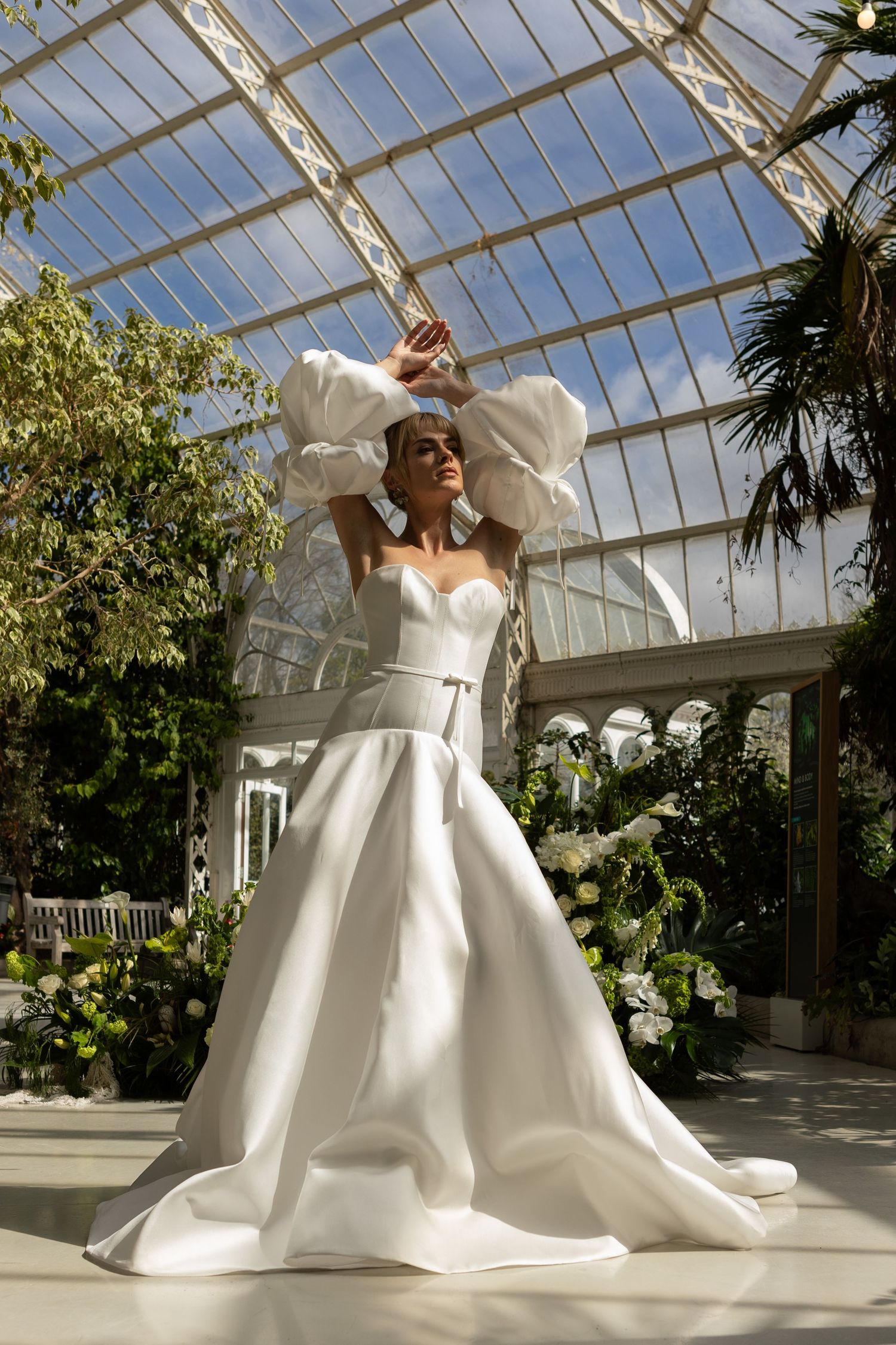 vogue style pose of bride with eyes closed and arms in the air during bridal portraits