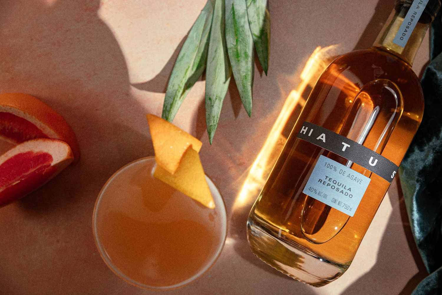Flat lay photography of styled cocktail and bottle shot by commercial photo and video company