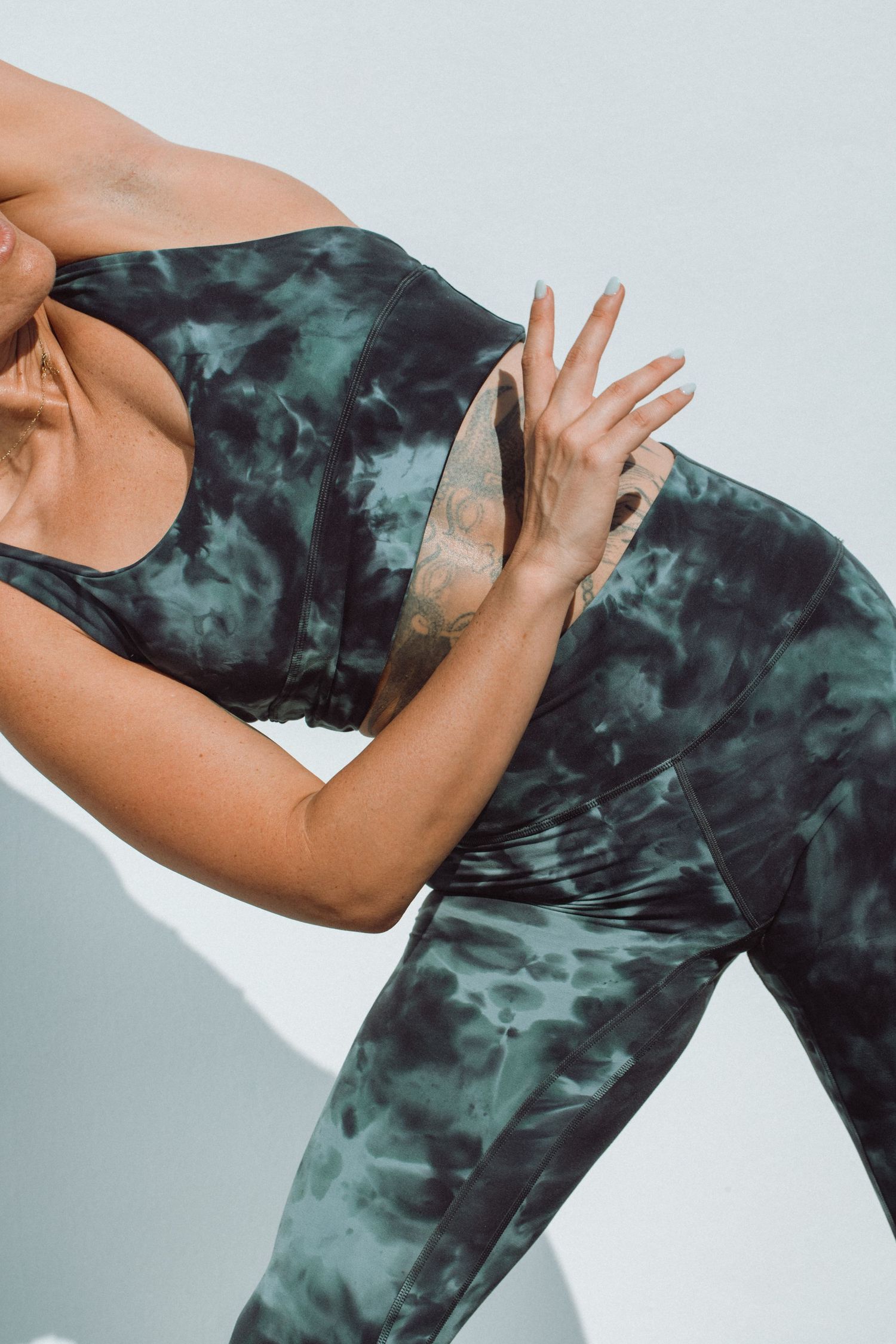 commercial photo of girl wearing an ice dye Lululemon set shot by commercial photographer in South Florida