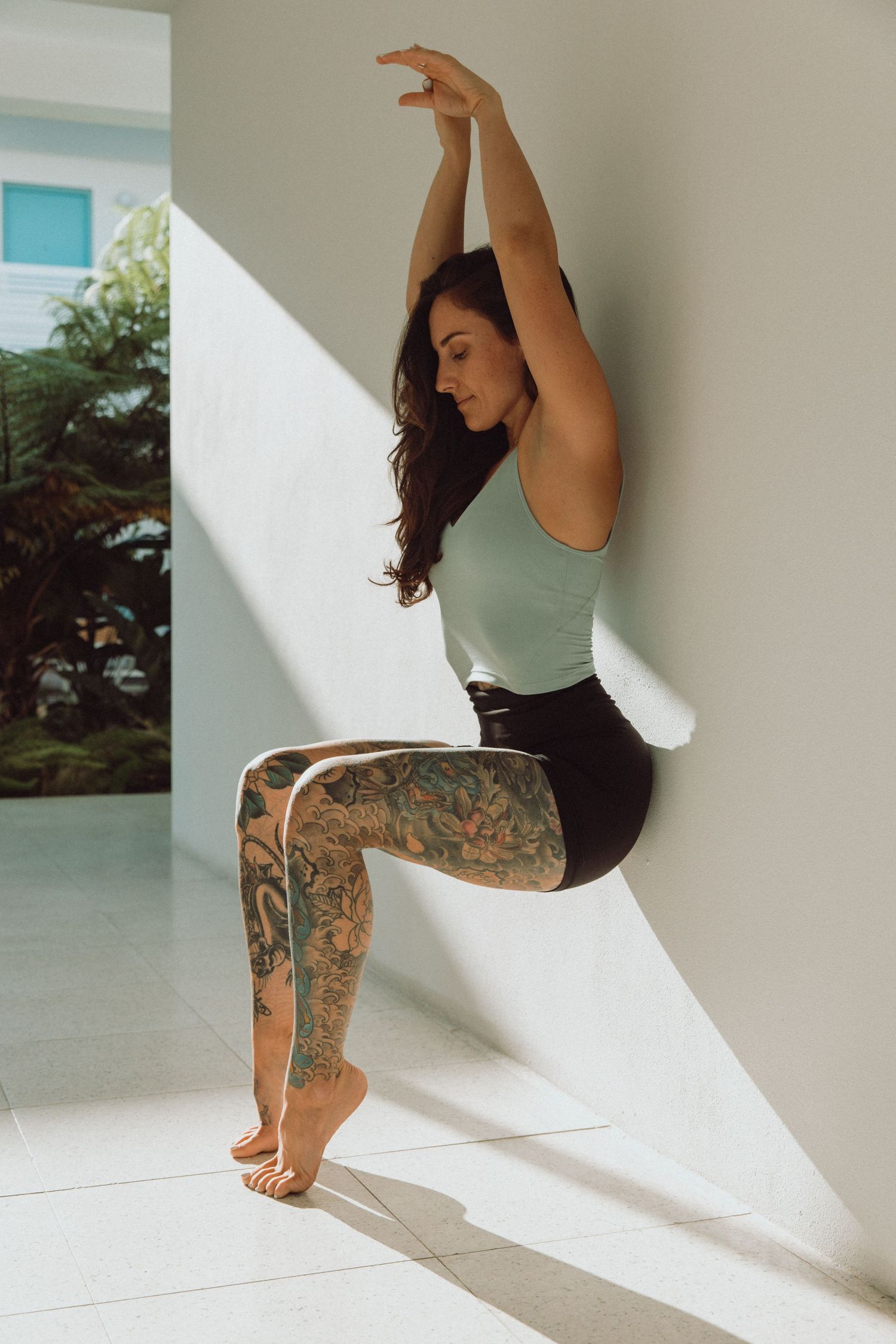 moody image of girl wearing Lululemon doing yoga shot by Fort Lauderdale based brand photographer