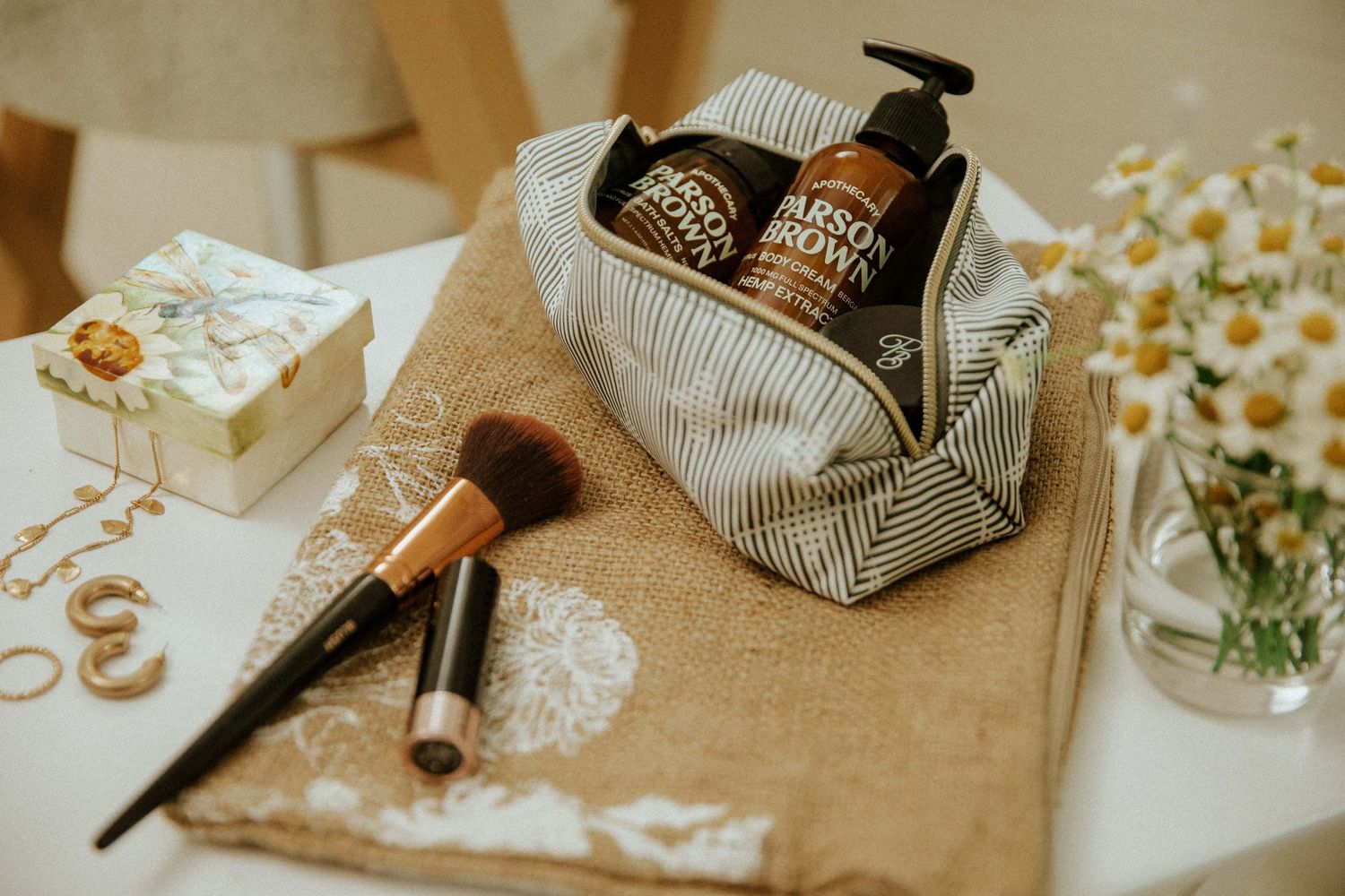 flat lay photography of self care products, jewelry and makeup shot by commercial photographer in Miami