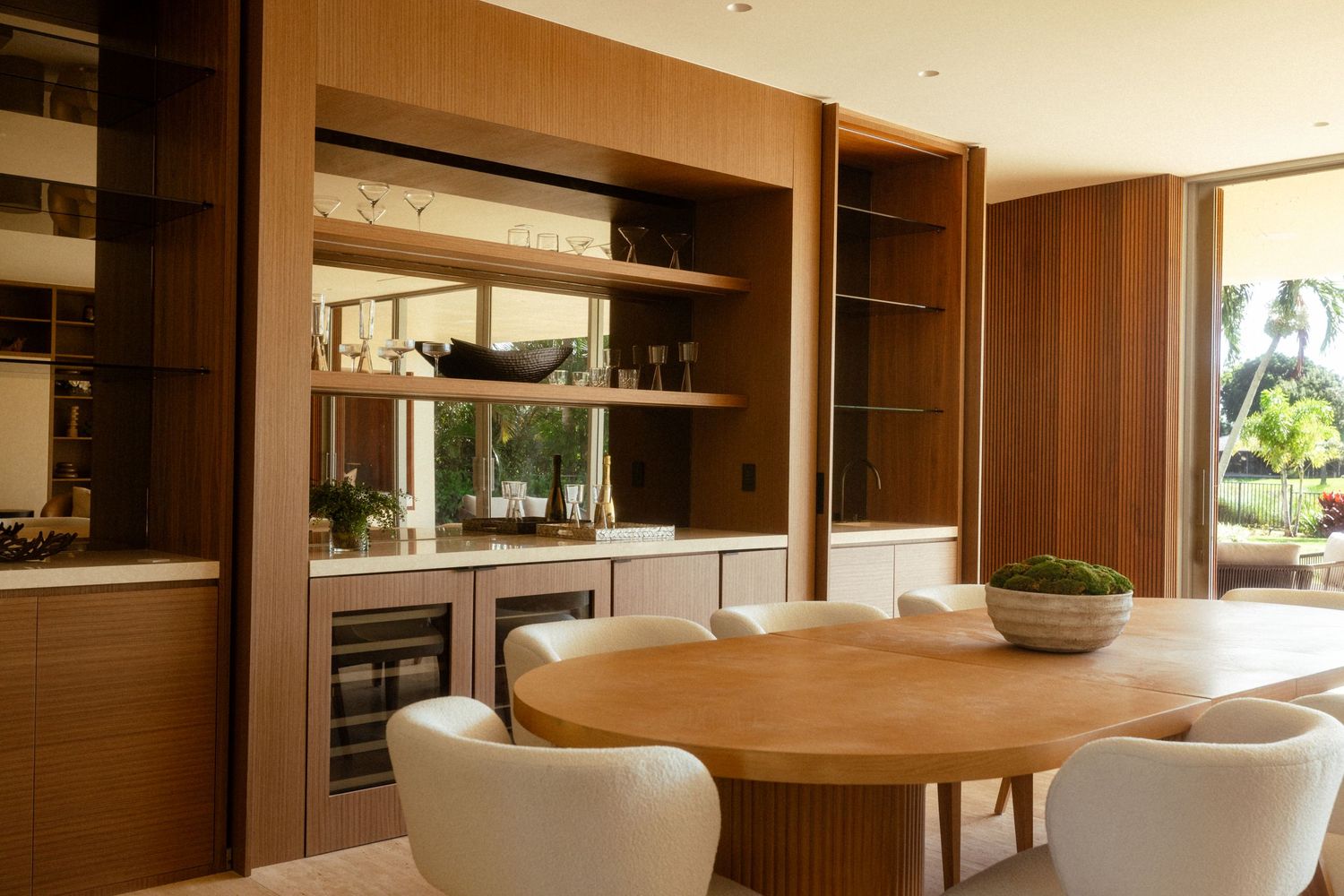 Interior design photography of a custom dining room with built-in millwork, warm wood finishes, and luxury residential design.