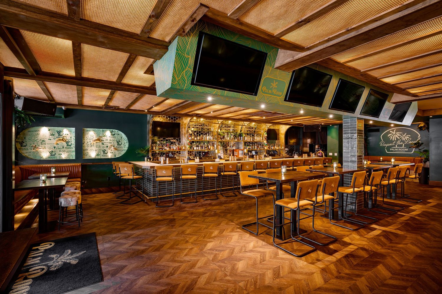 Modern sports bar interior with wood accents, chevron flooring, and custom lighting—captured by high end hospitality design photography.