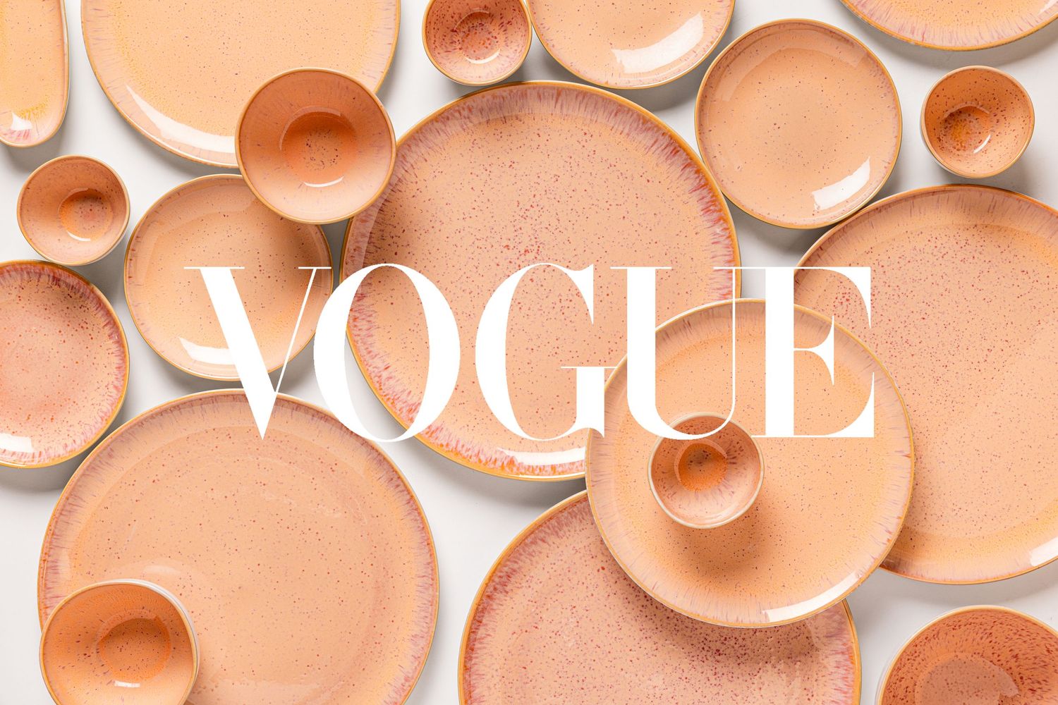 Styled product photography of handcrafted ceramic dinnerware arranged in a flat lay, highlighting artisan craftsmanship and design.