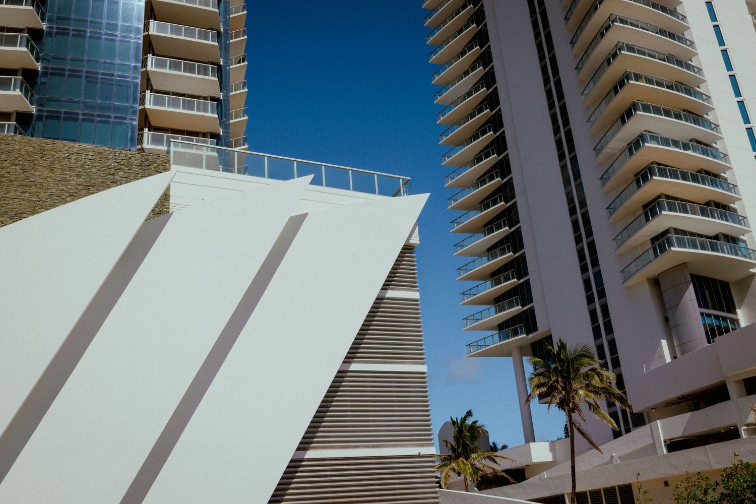 Contemporary high-rise buildings with bold lines and shadows, captured for modern urban architectural photography.