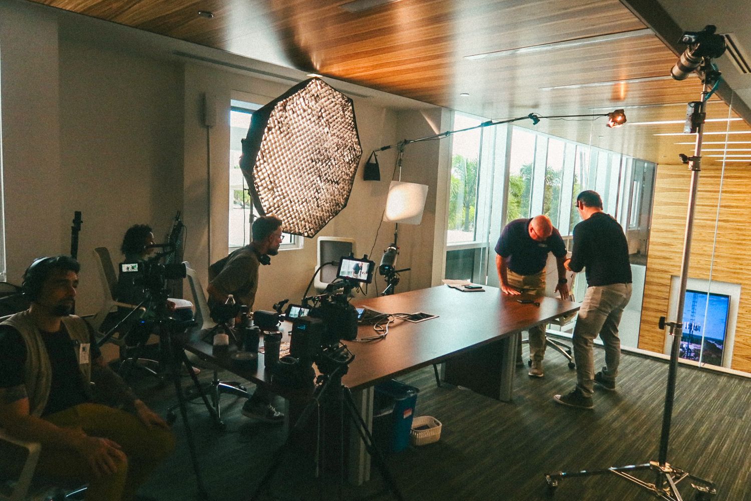 Behind-the-scenes video production setup for an executive interview, with professional cameras and lighting for a South Florida business.