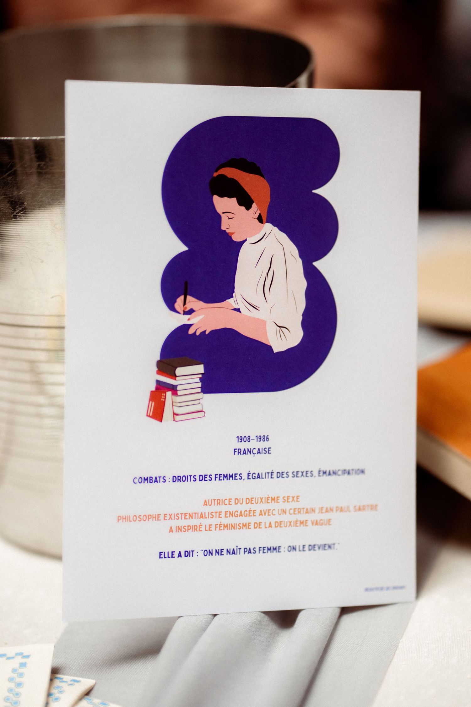 Illustrated card featuring Simone de Beauvoir with French text about womens rights and feminism.